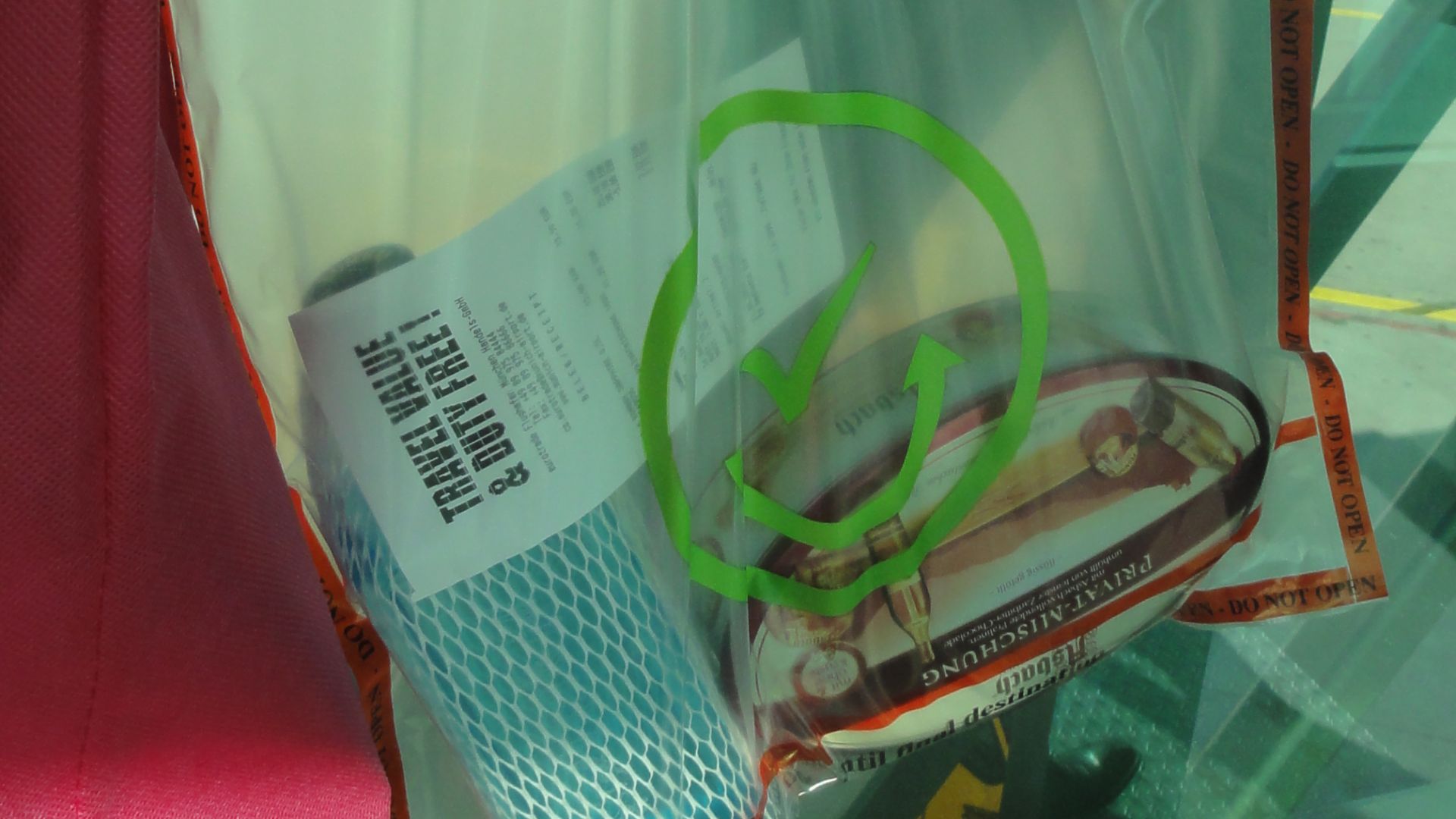 location of photographer  Germany > Bavaria > Munich airport

Motif: Sealed plastic bag for goods bought in the secured area of the airport (hand luggage), shall not be opened before custom clearance in the home airport.