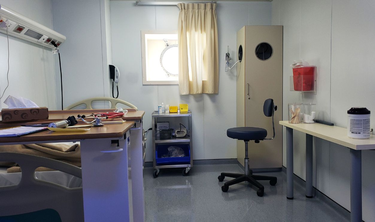 Cruise ship medical center office during COVID-19 pandemic. All crew members to be tested on COVID-19