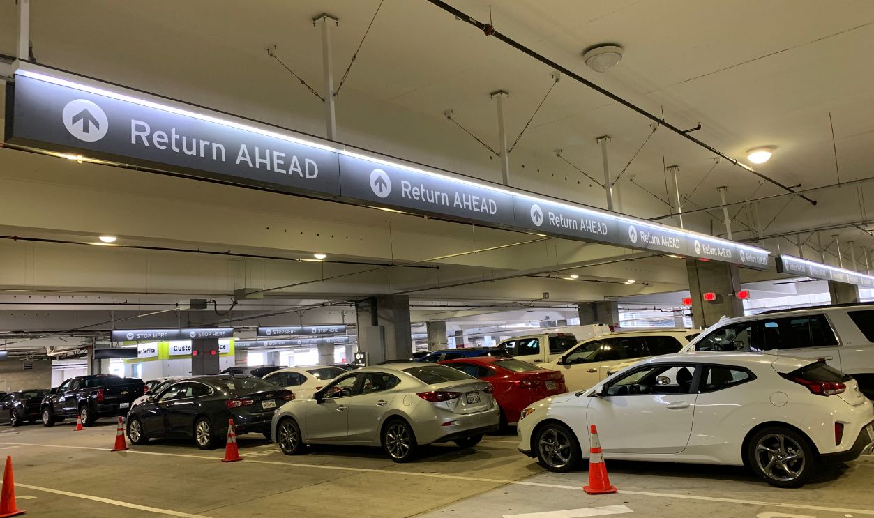 San Diego, CA (USA) - June 2, 2019. The San Diego International Airport rental car shuttle area where passengers can easily pick up and return their rental cars from a variety of rental car companies.
