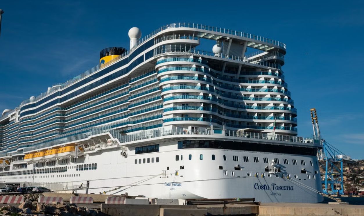 Costa Toscana cruise ship docked at a sunny harbor, showcasing modern luxury