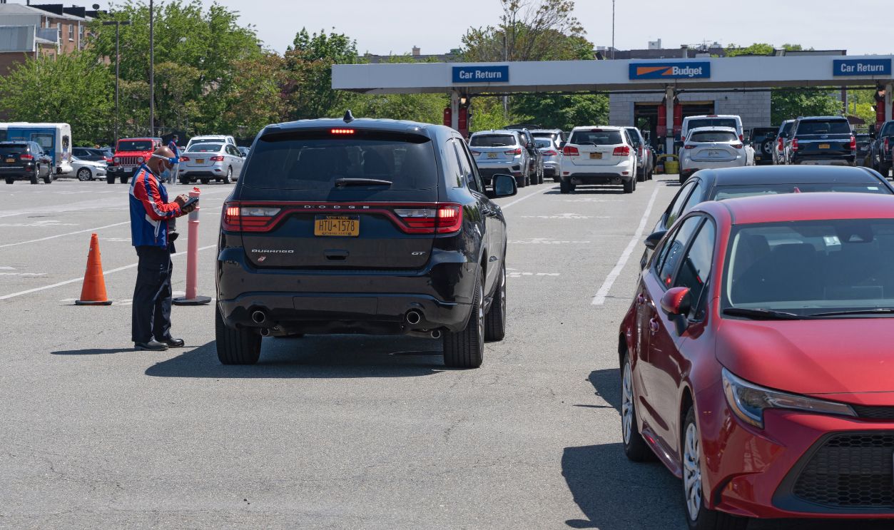NEW YORK, NEW YORK - MAY 25: An employee wearing protective gears is seen at Budget Rent a Car lot amid the coronavirus pandemic on May 25, 2020 in New York City.