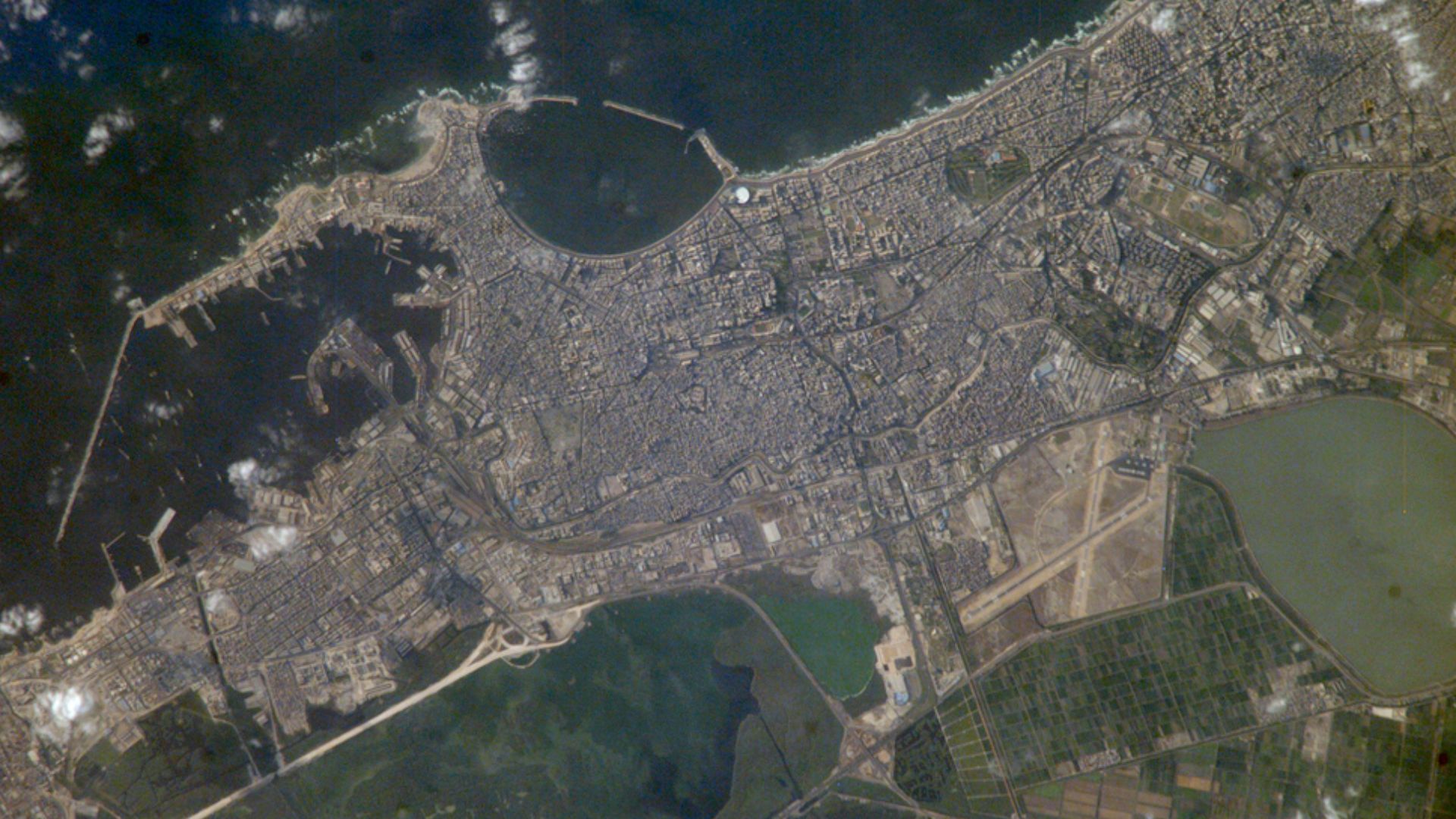Founded by Alexander the Great in 331 BC on the Mediterranean coast of Egypt, Alexandria became a center of trade and learning in the ancient world. Alexander built the causeway between the Eastern and Western Harbors, joining Pharos Island (arrow) to the