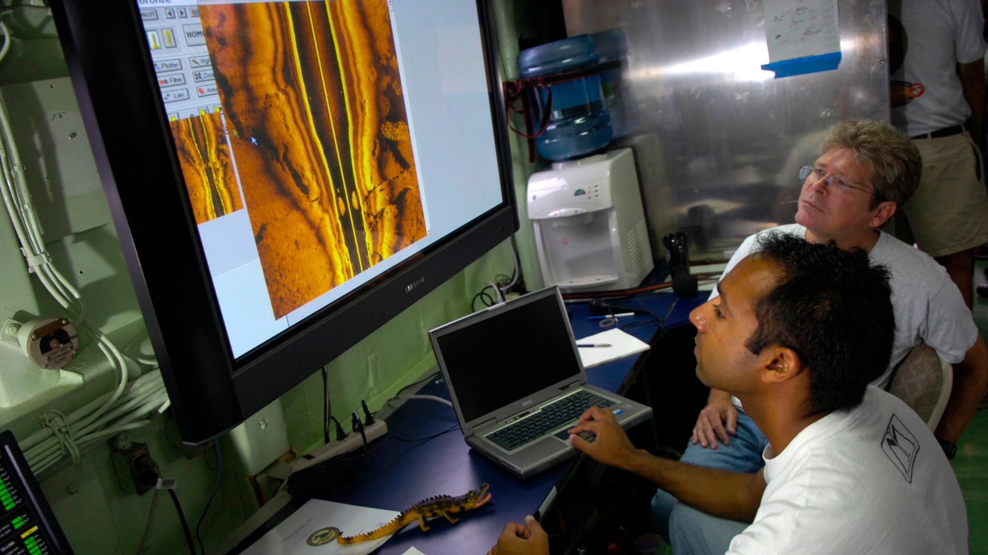 Atlantic Ocean (Sept. 10, 2005) - Aamir Qaiyumi, foreground, and Mark Connelly, with Naval Sea Systems Command (NAVSEA) in Panama City, Fla., analyze data from Remote Environmental Monitoring Units (REMUS) aboard the Office of Naval Research (ONR) vessel,