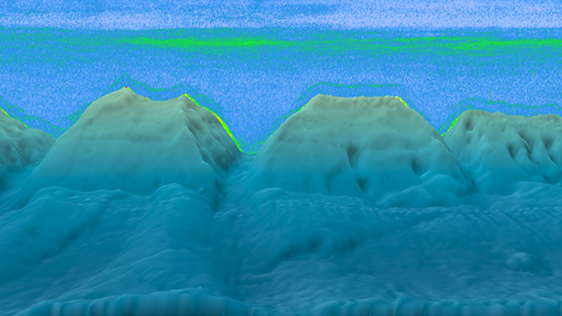 Static image of a sonar scan conducted by the NOAA Okeanos Explorer in the North Atlantic Ocean.  The backscattered signal (green) above the bottom is likely the deep scattering layer.
