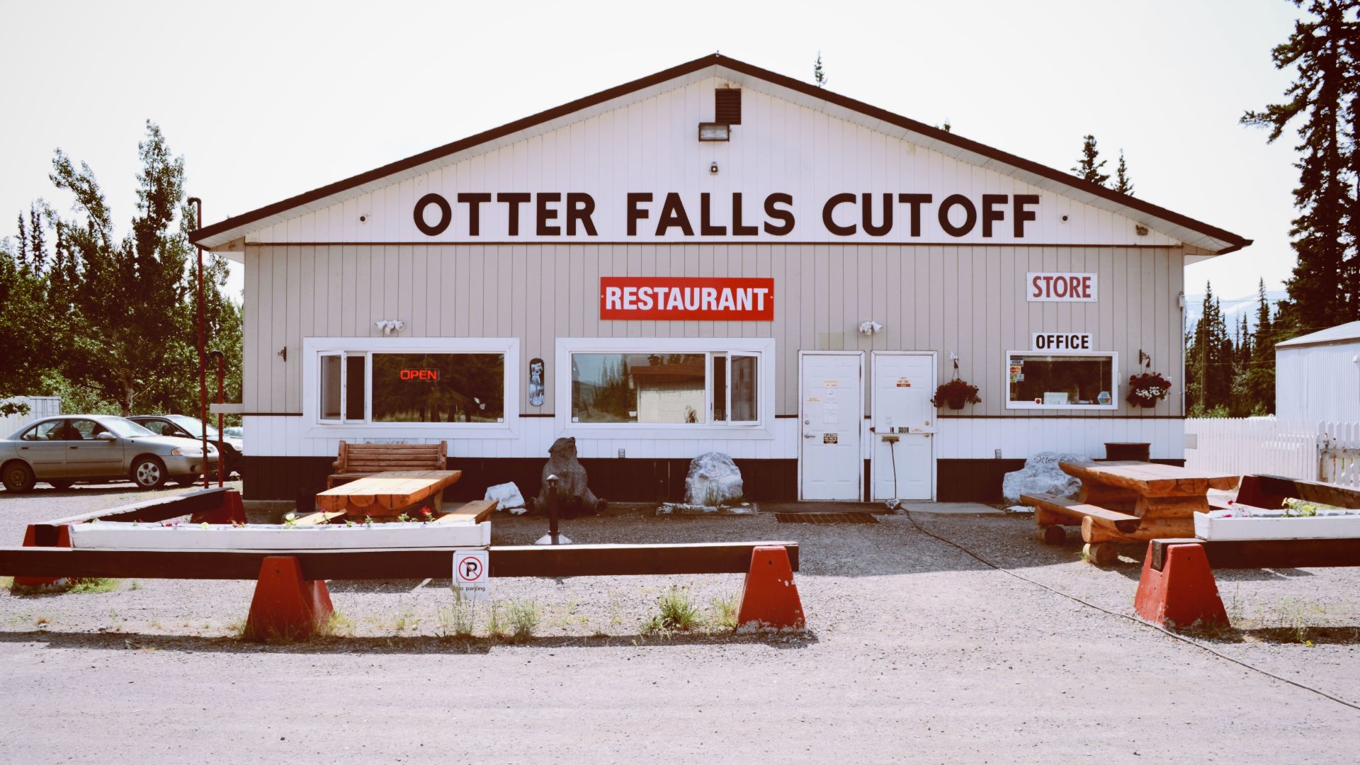 View of the front entrance and facade of the Otter Falls Cut Off rest stop on the Alaska Highway in Yukon Territory, Canada. One of the many different roadhouses along the highway; they usually offer a RV pull ins, campsites, a small restaurant, a small c