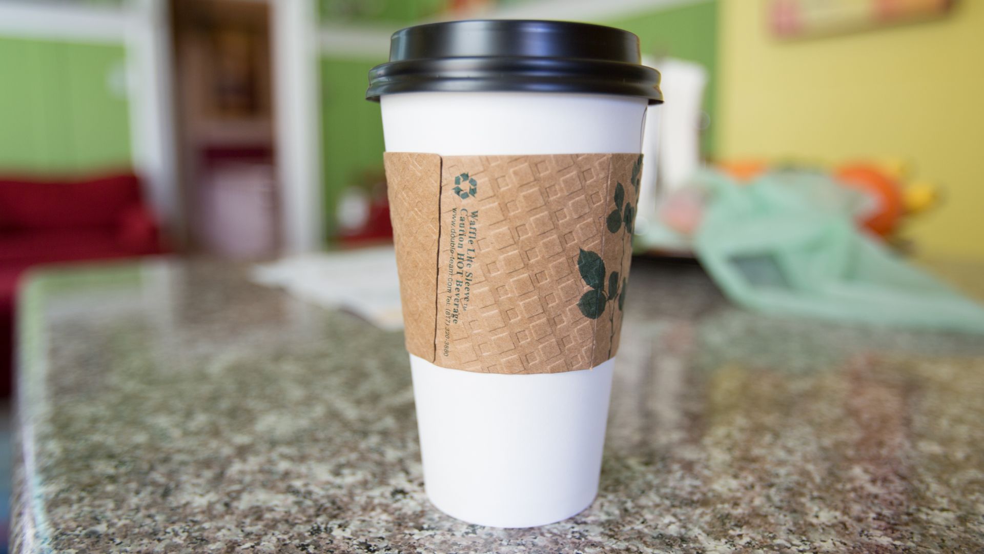 Coffee cup sleeve on a coffee cup, sleeve makes it easy to hold hot drinks.