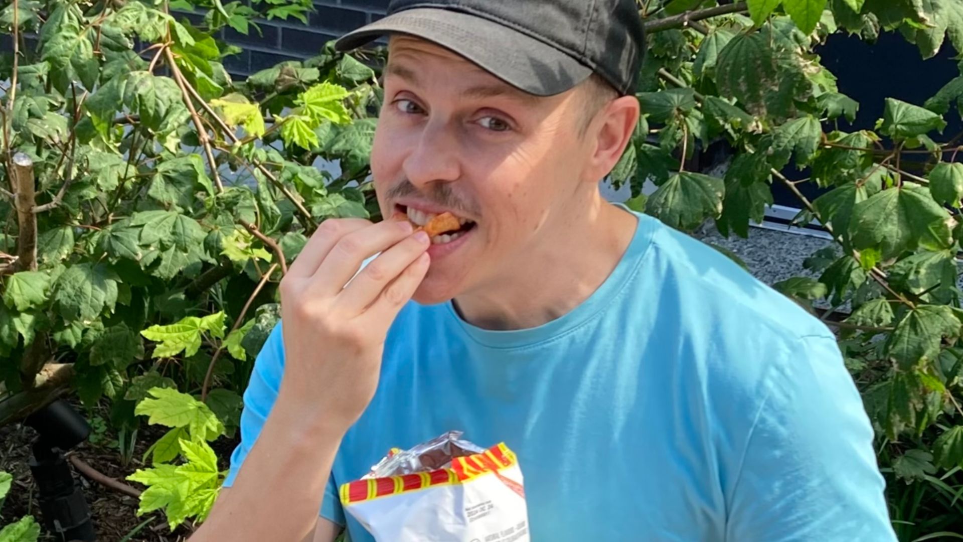 Man enjoying a ketchup chip
