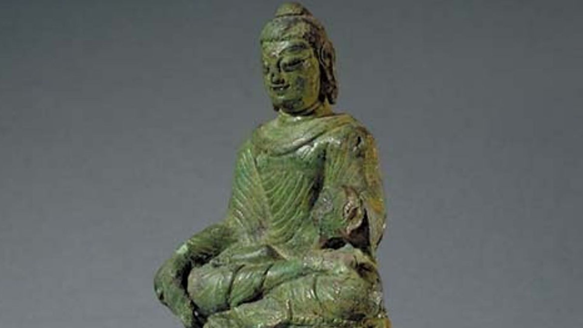 Photograph of the Helgö Buddha at the Statens historiska museum