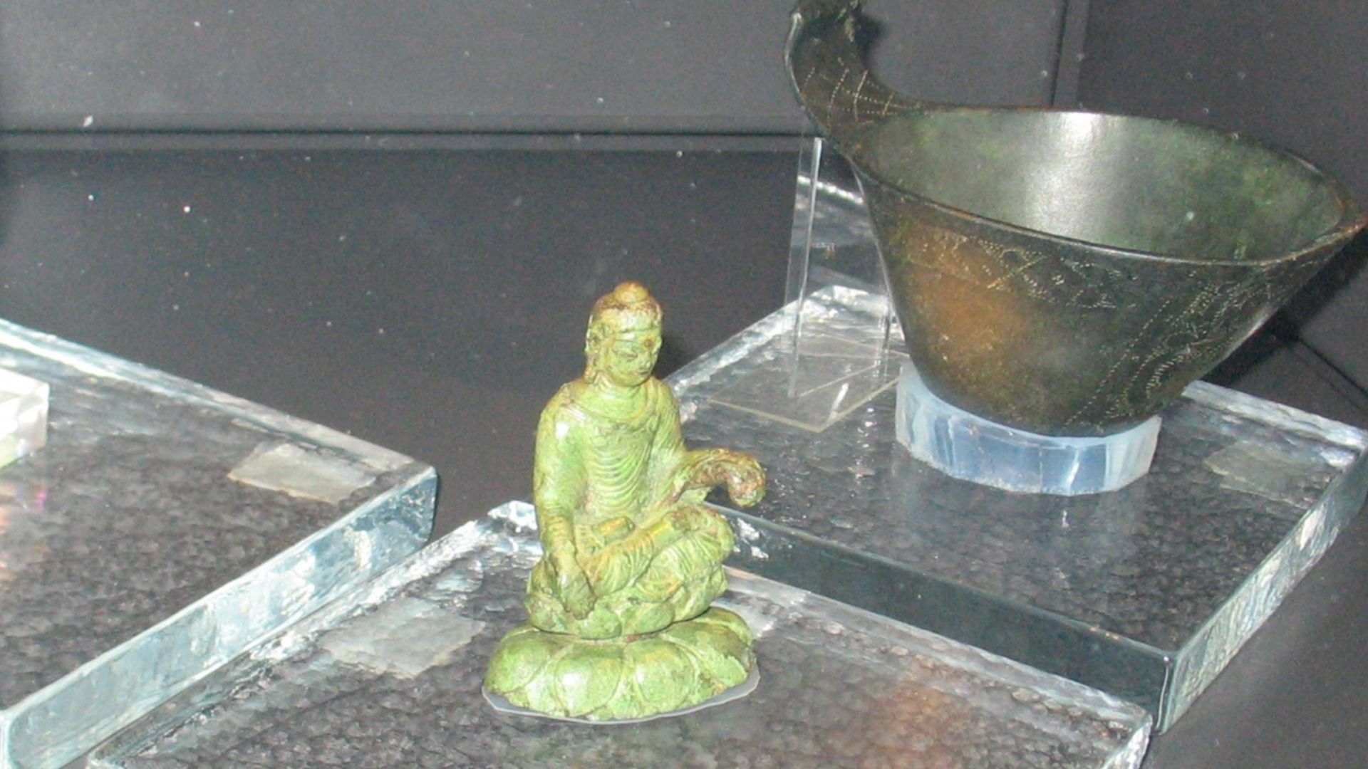 An Irish crozier, an Indian Buddha statuette, and an Egyptian scoop, from a Viking settlement.