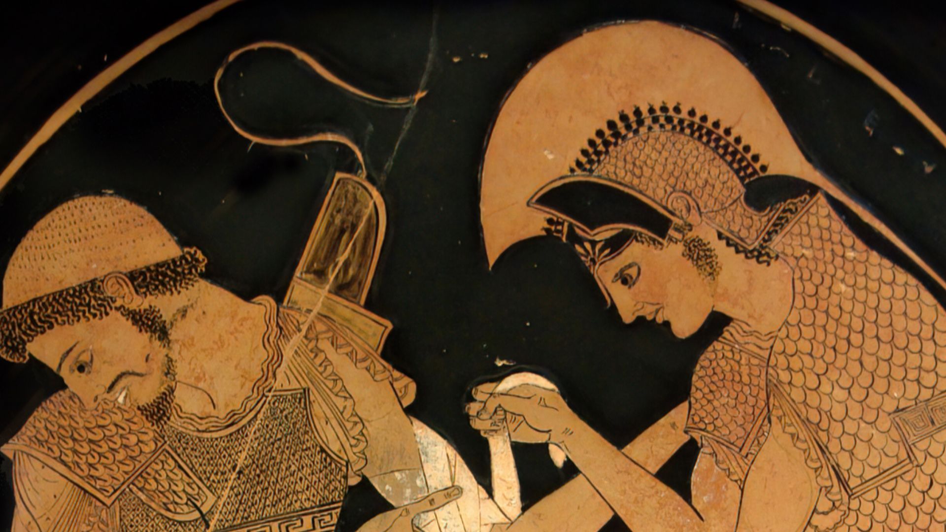Achilles tending Patroclus wounded by an arrow, identified by inscriptions on the upper part of the vase. Tondo of an Attic red-figure kylix, ca. 500 BC. From Vulci.