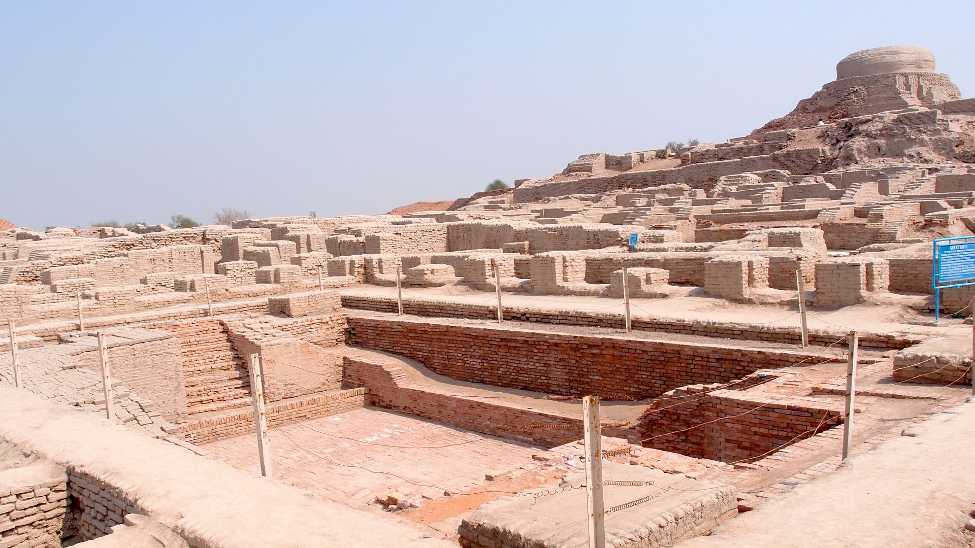 Excavated ruins of Mohenjo-daro, with the Great Bath in the foreground and the granary mound in the background