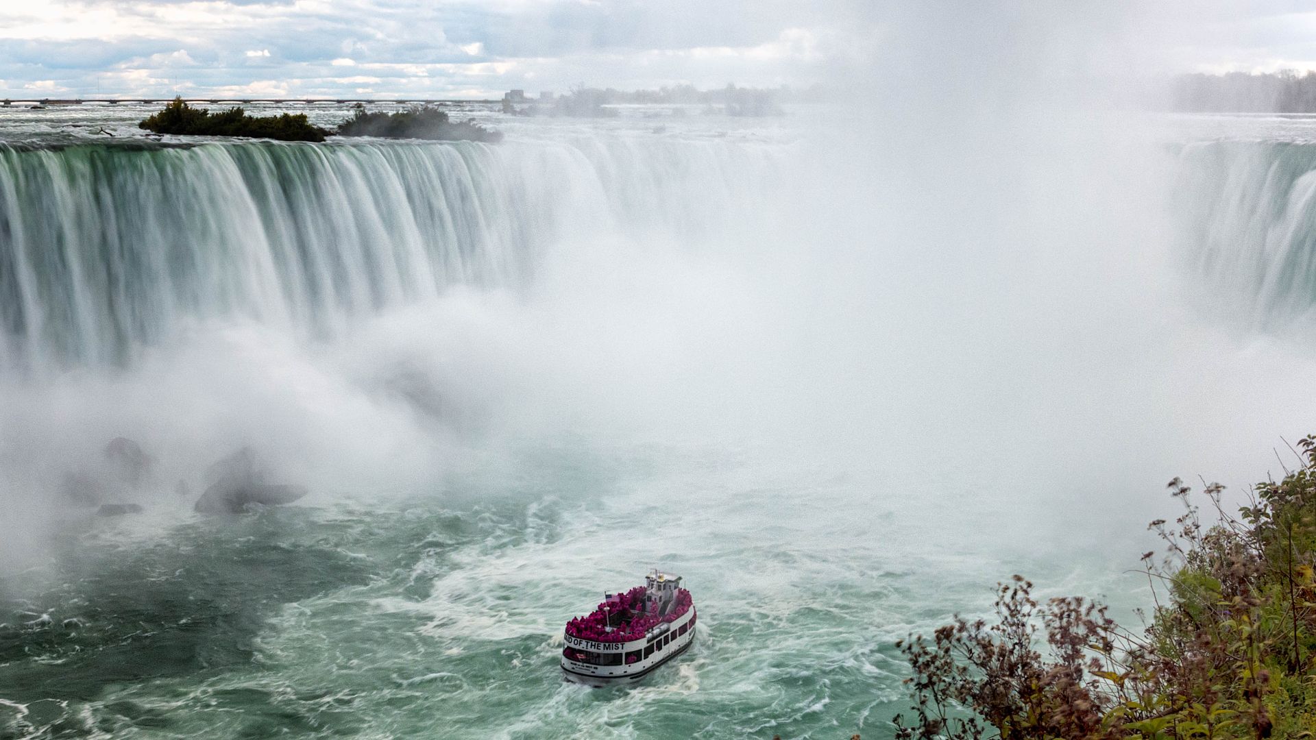 You can ride the Maid of the Mist to the base of the falls but you're going to get wet.  Taken during the Scott Kelby 2014 World Wide Photo Walk.