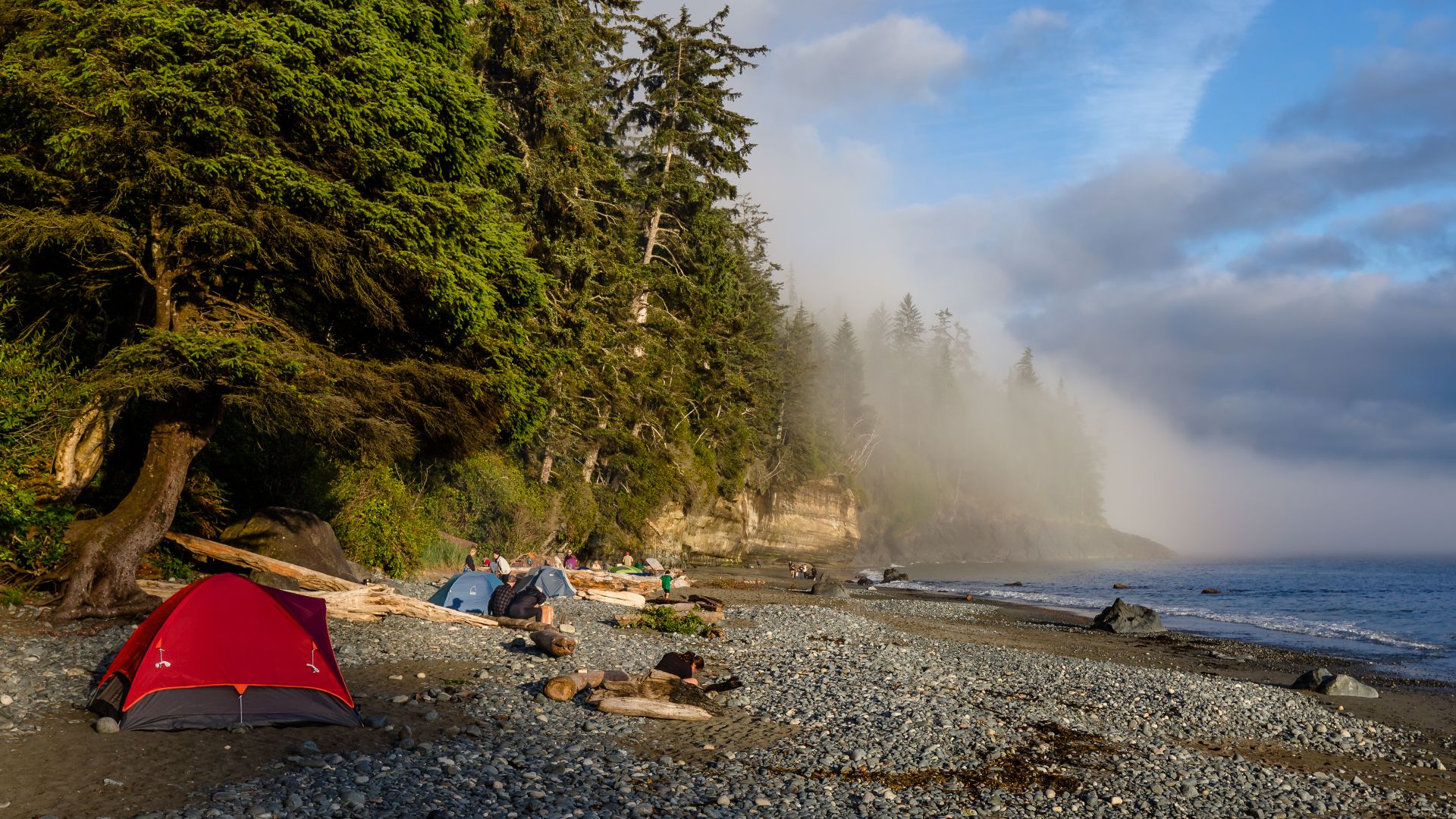 Campsite at Mystic Beach at the beginning of the golden hour, Vancouver Island, Canada. The campsite was quite busy that day due to Canada Day which made the weekend 3 days long and is a popular weekend for camping in Canada