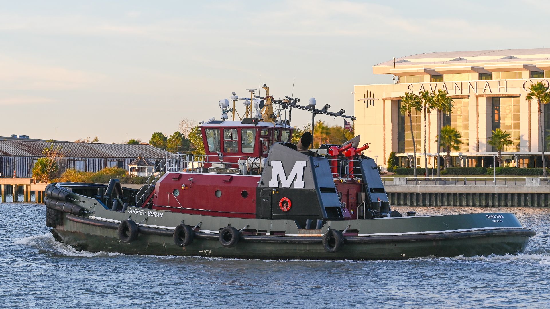 Moran Towing tugboat, COOPER MORAN - IMO 9812547, on the Savannah River beside the Savannah Historic District, Georgia, USA on November 27, 2023.