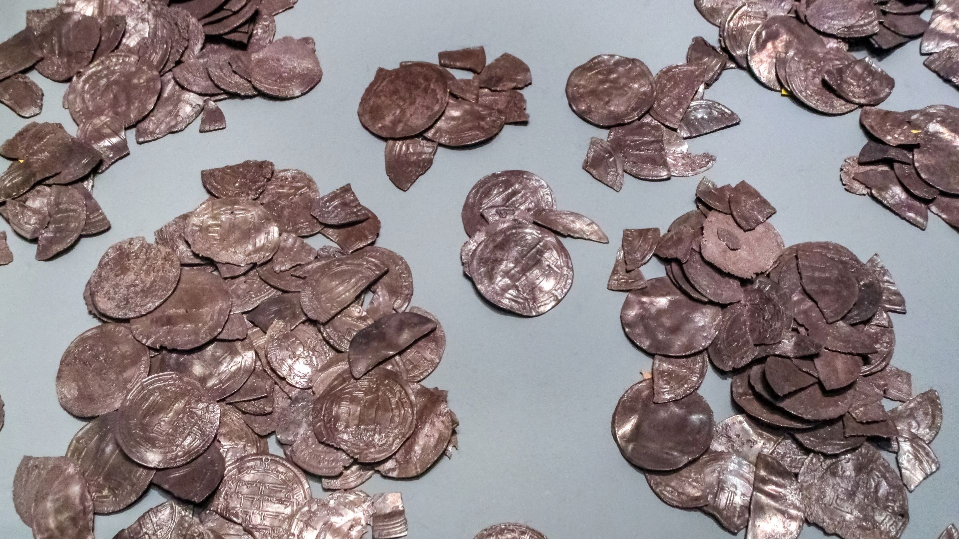 Closeup of silver coins from hoard No 2 of the Spillings Hoard at Gotland Museum, Visby, Gotland, Sweden.