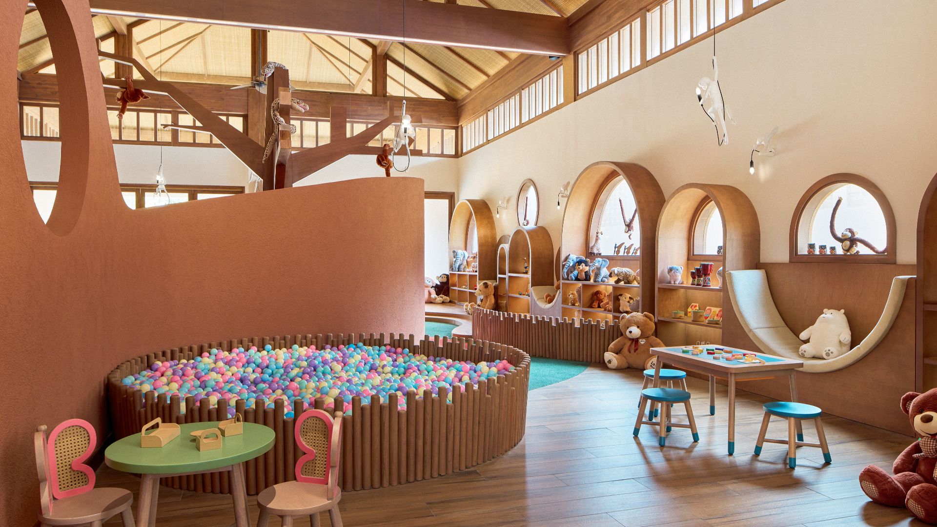 Interior of Kidsdom Kids Club at Paradisus by Meliá Bali, featuring colourful tables, toys, seating and indoor & outdoor activity areas designed for children