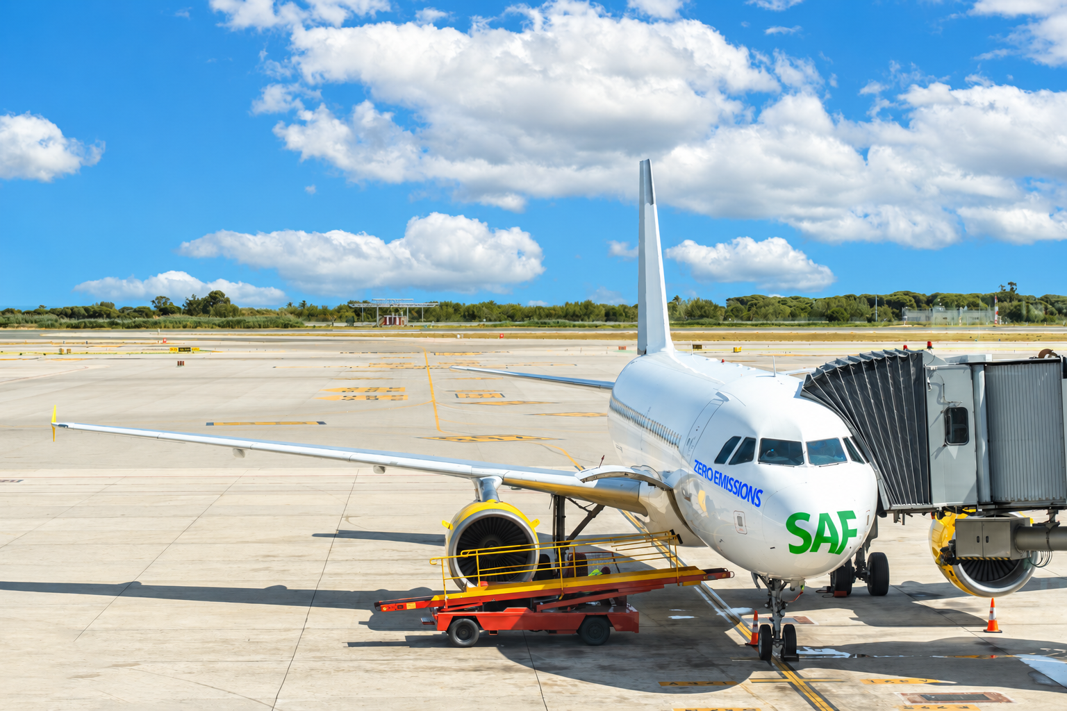 Commercial aircraft at airport with SAF text