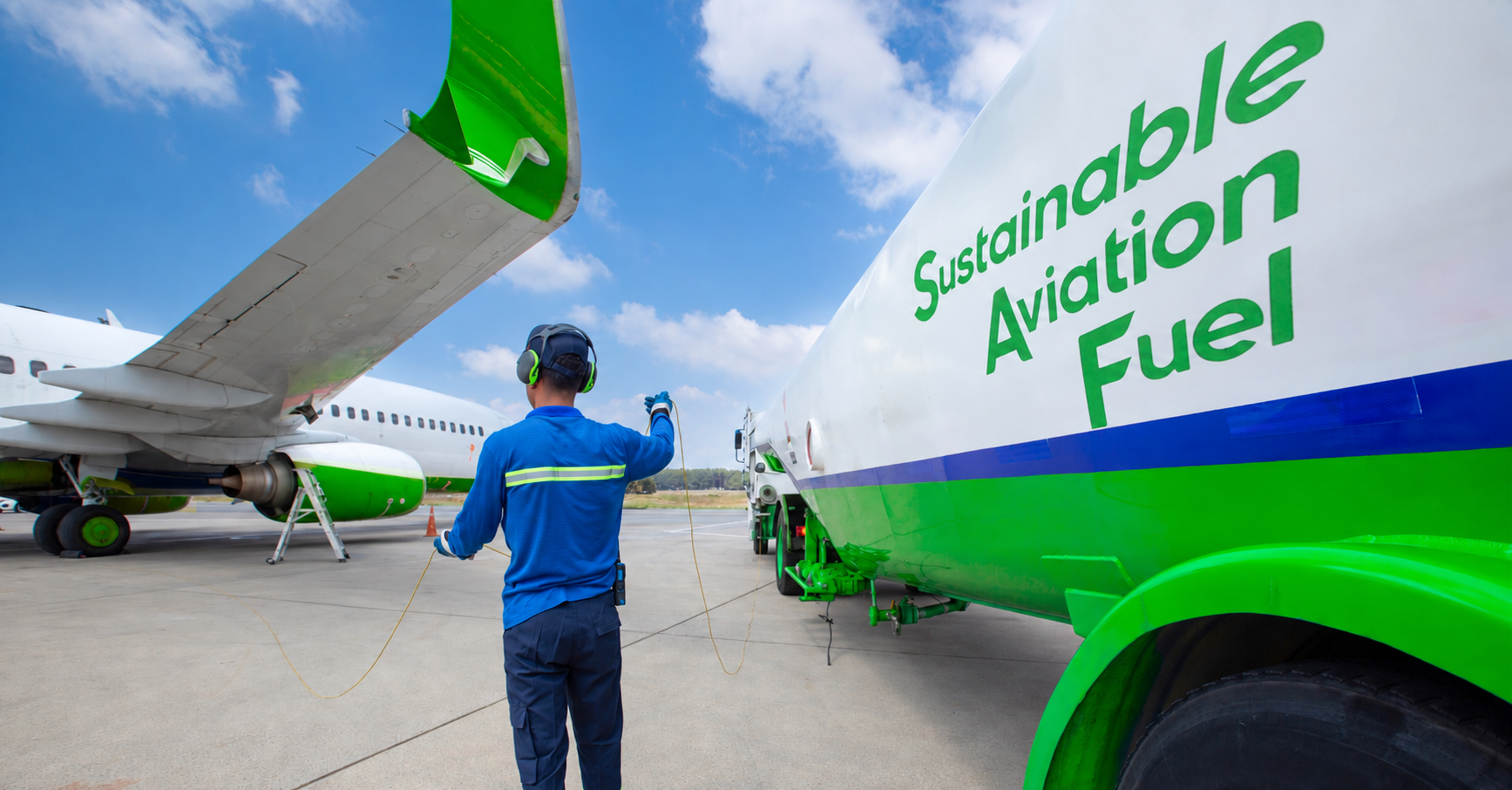 Sustainable Aviation Fuel (SAF) technician refueling a plane