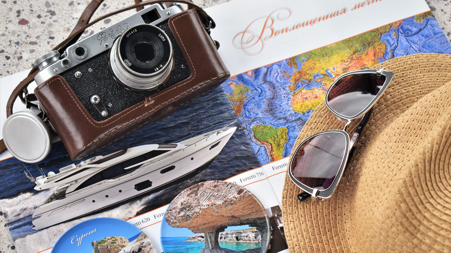 Explore travel with a vintage camera, map, and accessories perfect for a getaway.