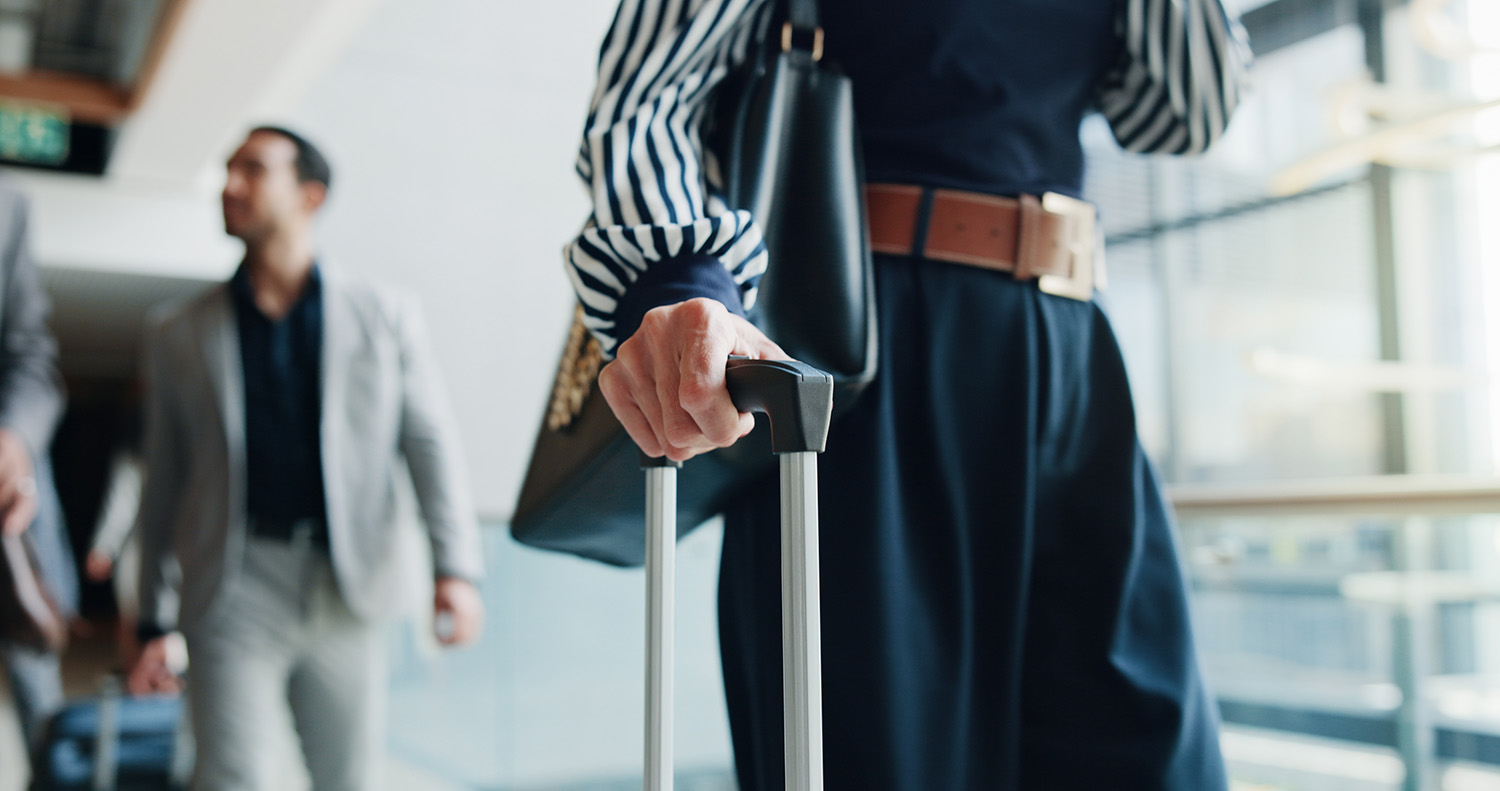 Business people, walking or hands with suitcase for travel, job opportunity or career trip at airport. Closeup, employee or traveler with luggage handle for commute, flight or journey in city or town