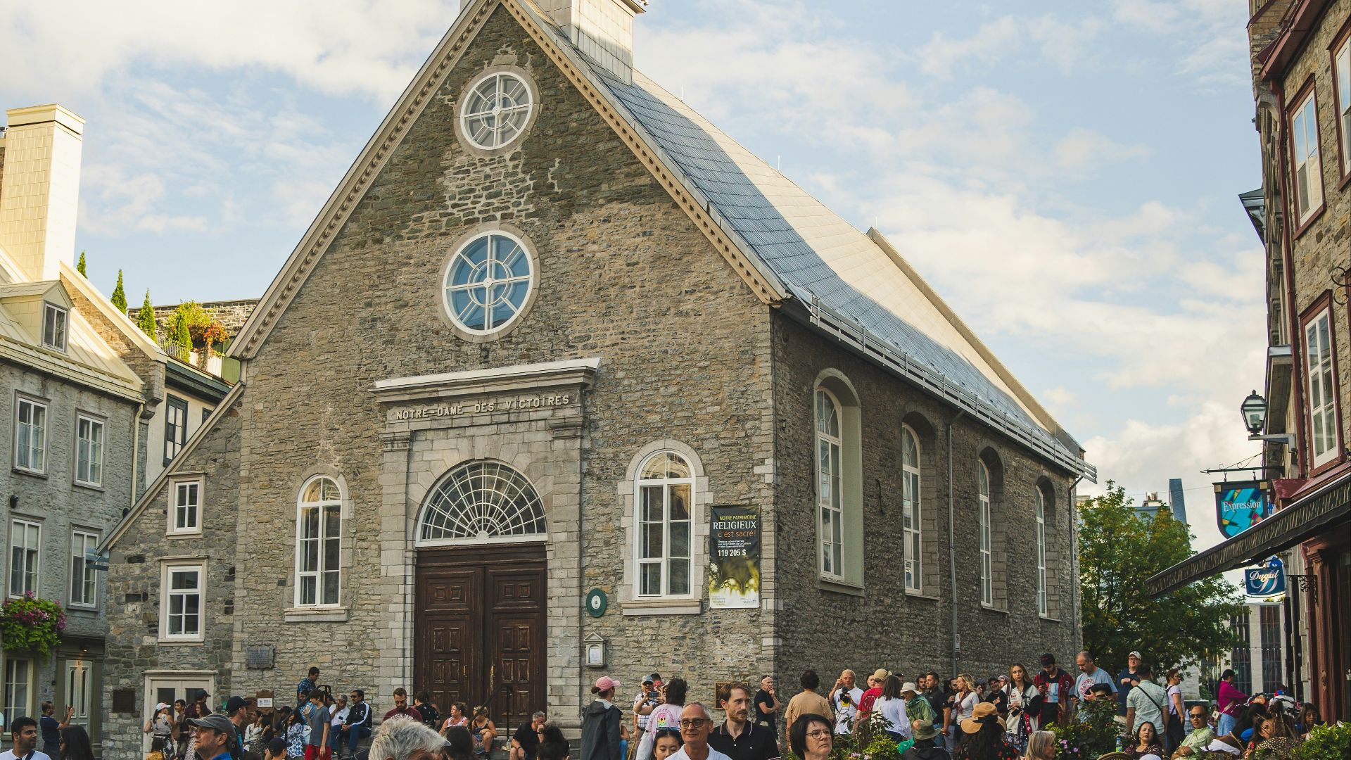 a group of people walking in front of a church