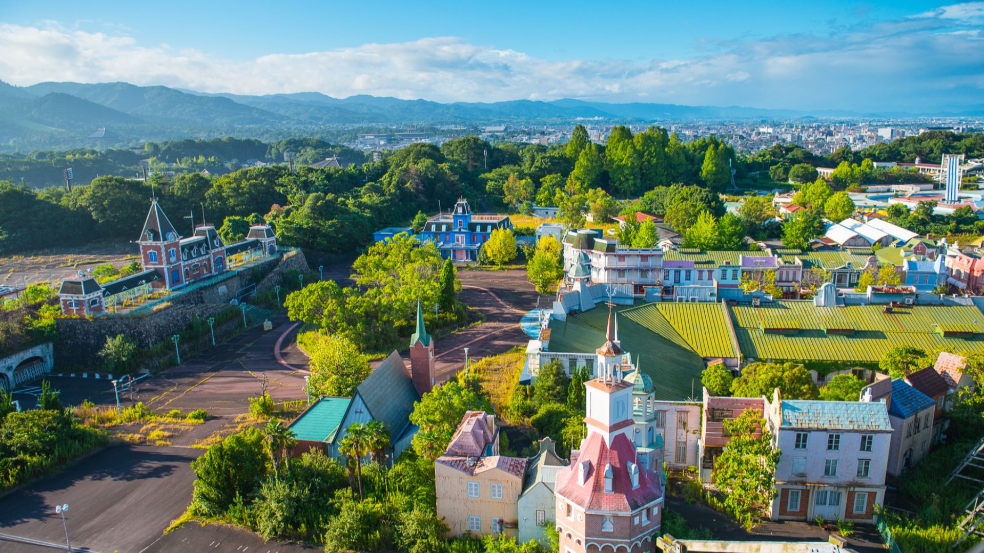 Nara Dreamland, an abandoned attraction park in Nara, Japan. The city of Nara can be seen in the background.