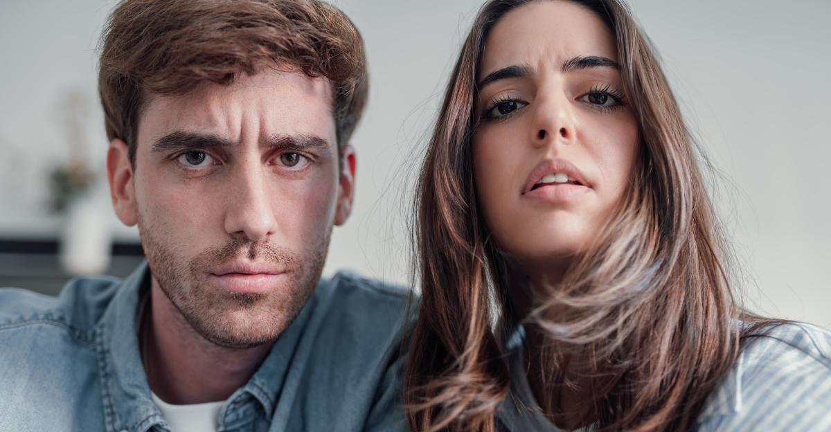 Confused couple touching camera 