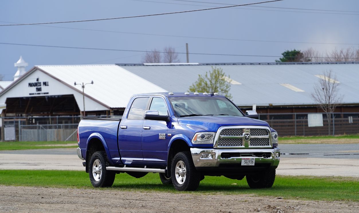 Tomah, Wisconsin USA - April 29th, 2023: Blue 2010 Dodge Ram 2500 pickup Truck sits at roadside unused.
