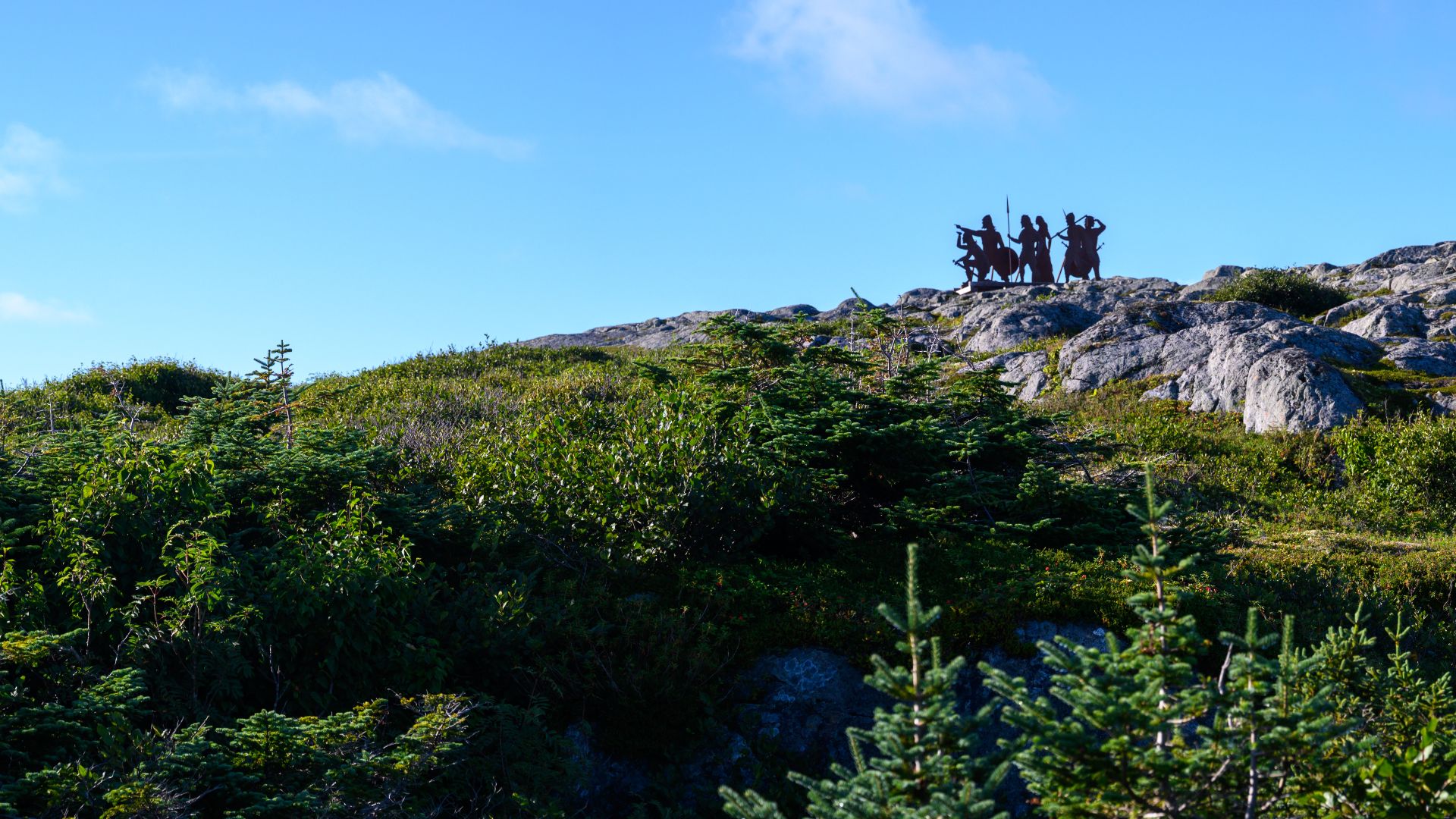 Norse silhouette sculpture above L'Anse aux Meadows National Historic Site, Newfoundland, Canada on August 27, 2022.  
This sculpture commemorates the arrival of the Vikings in approximately 1021 and was designed by New Brunswick artist, Karen Van Niekerk