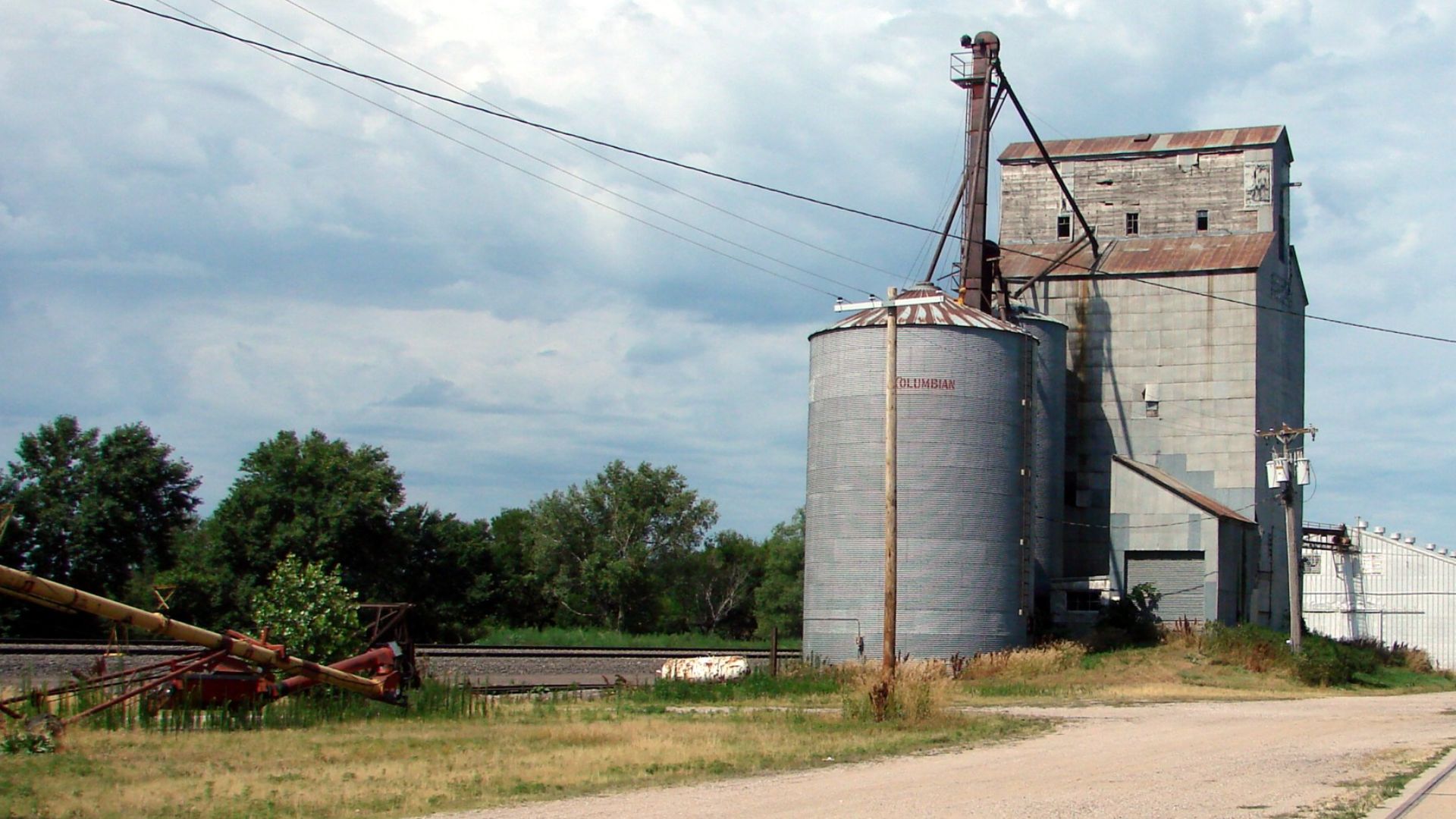 (1 in a multiple picture set)
When I was a boy in Iowa, the grain elevator like this one in Nebraska was one of the busiest businesses in town, especially at harvest time.  This one was closed up a long time ago.