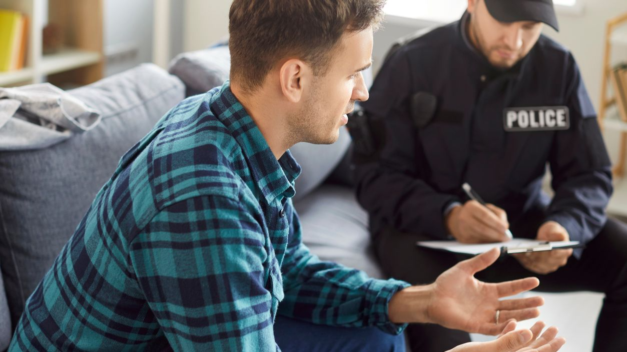 Shutterstock-2540303369, Policeman interrogating, officer police man in uniform, witness interview, interviewing suspected criminal, listening to complains, writing crime report gathering prosecution evidence, patrolling