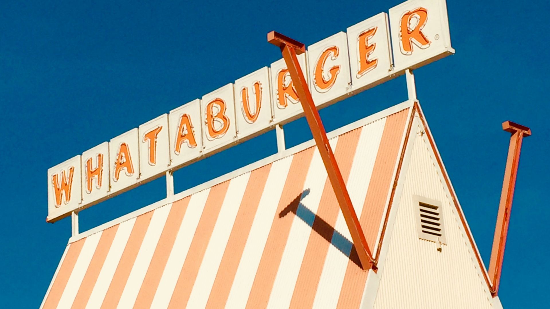 white and brown wooden signage