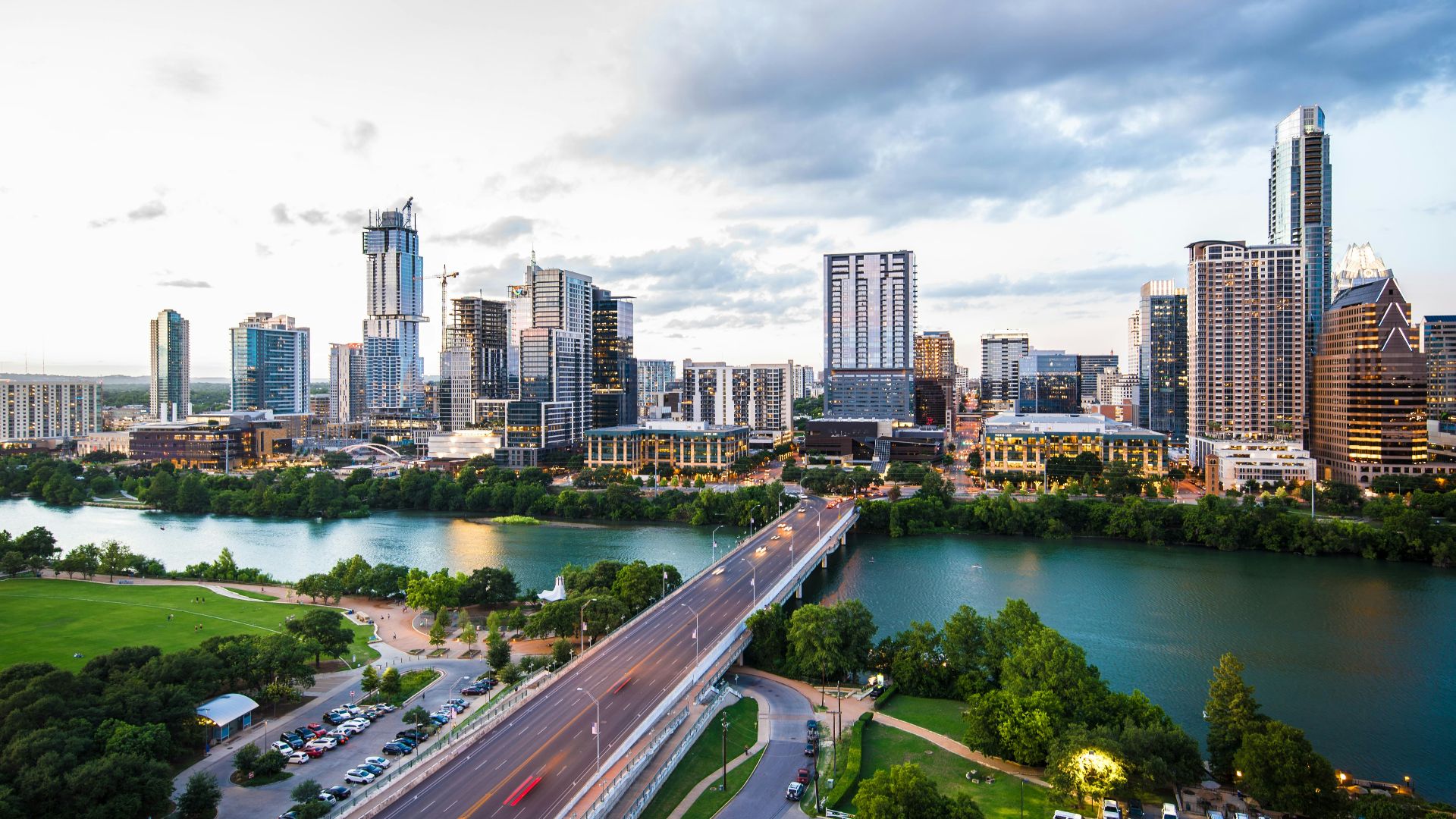 An aerial view of the Austin skyline and Congress Avenue Bridge over Lady Bird Lake