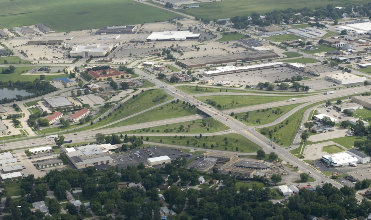 An interstate cutting through the heart of a green Midwestern town.