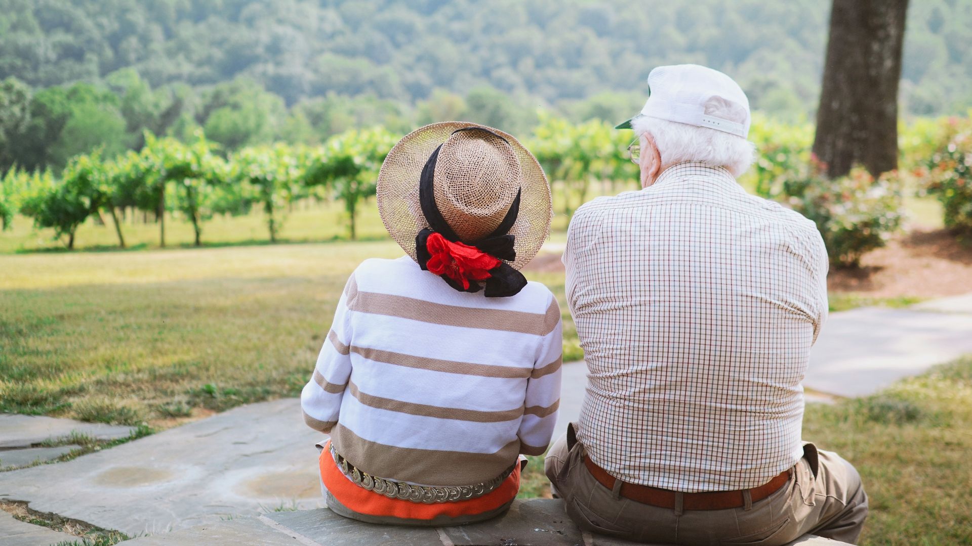 couple sitting on pathway