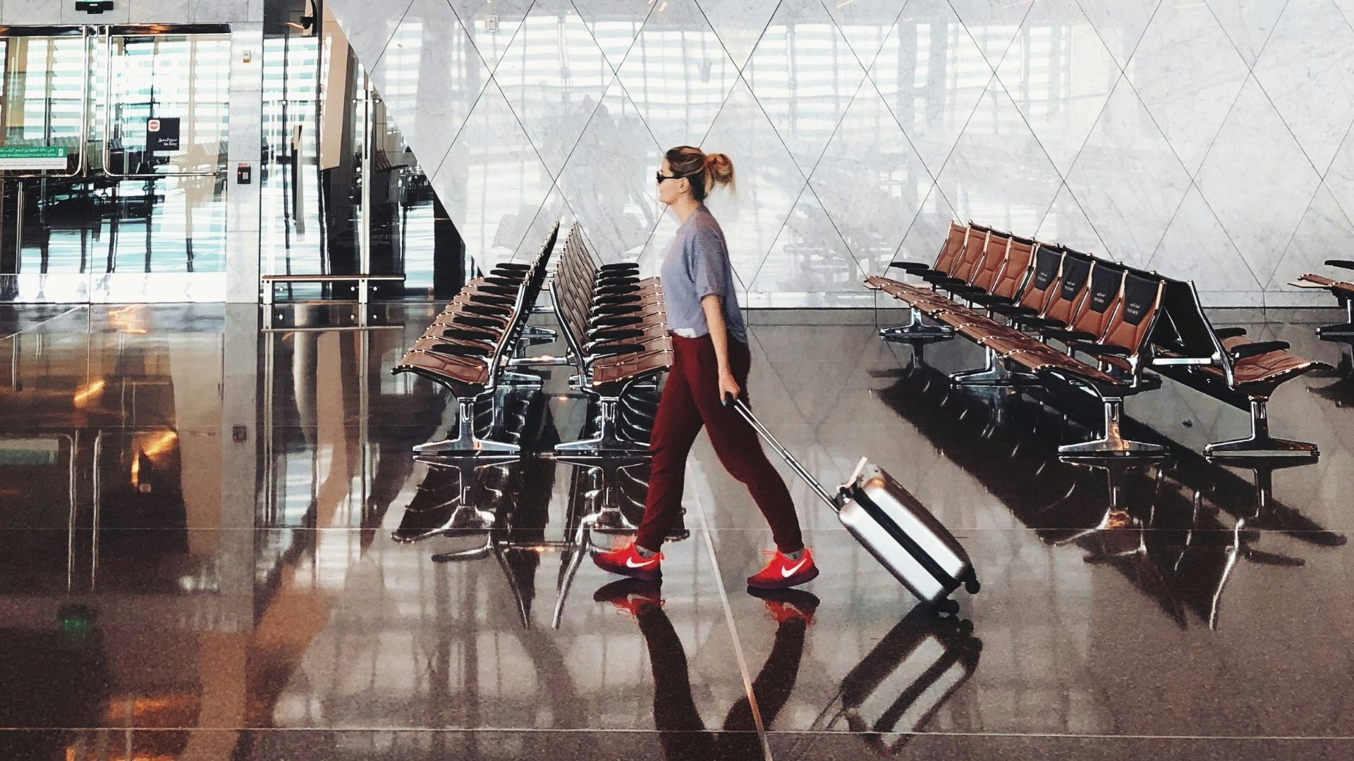 person walking inside aiport