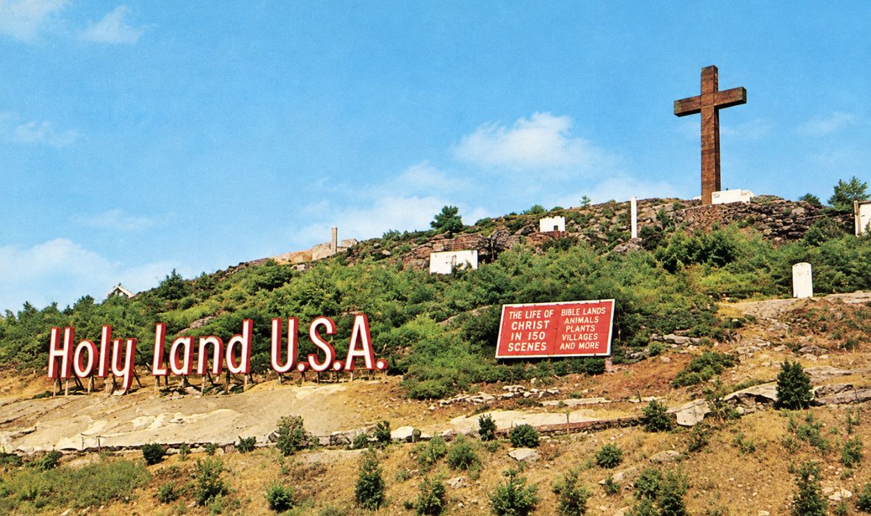 Postcard of the sign and cross at Holy Land USA 