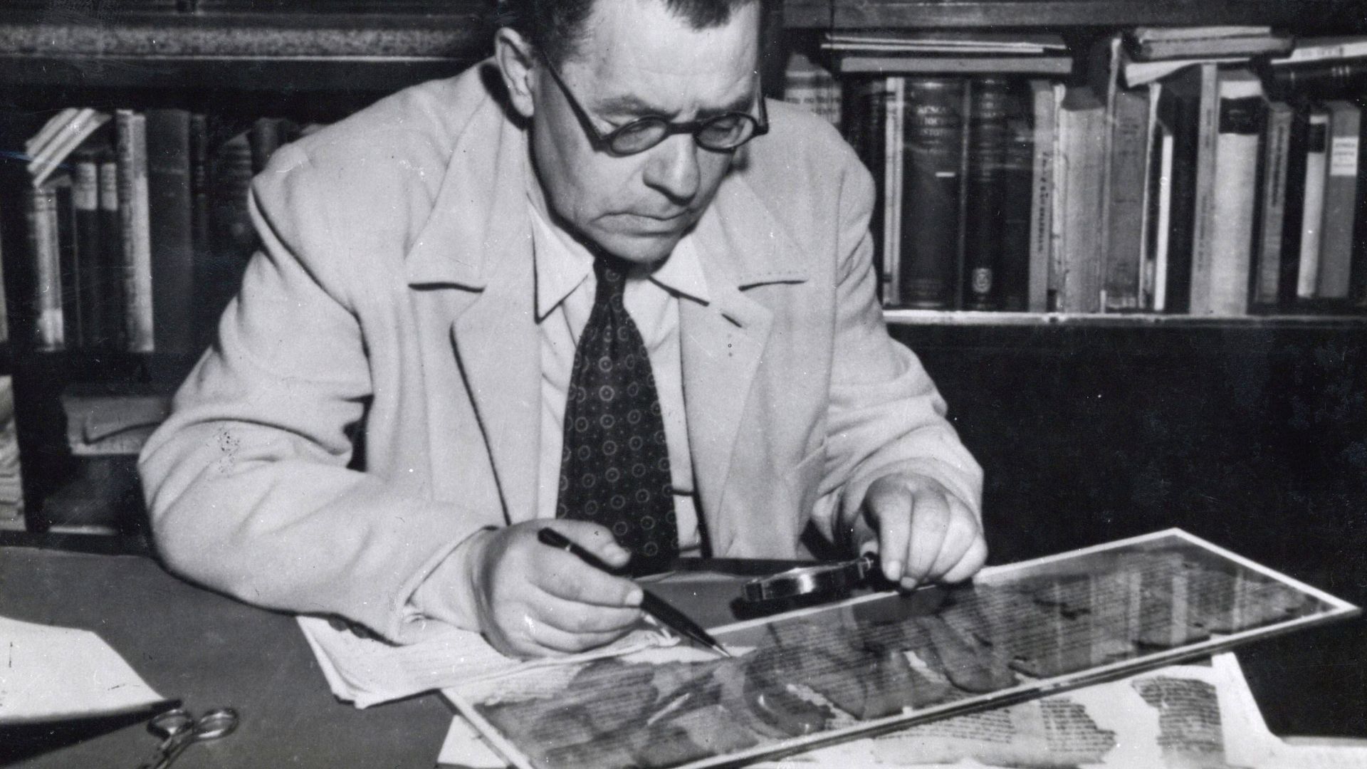 Picture of Eleazar Sukenik with one of the Dead Sea scrolls
