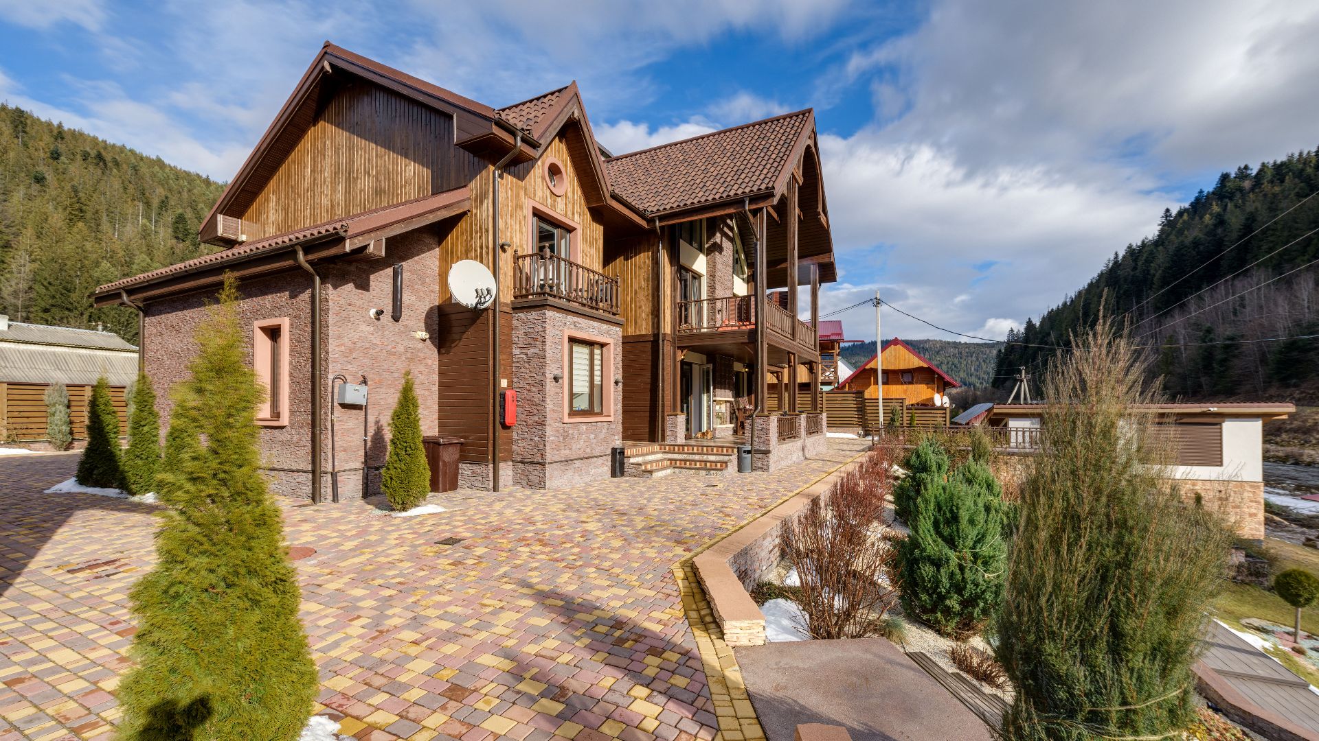 Cozy mountain chalet with spacious driveway and scenic views, perfect for a getaway.