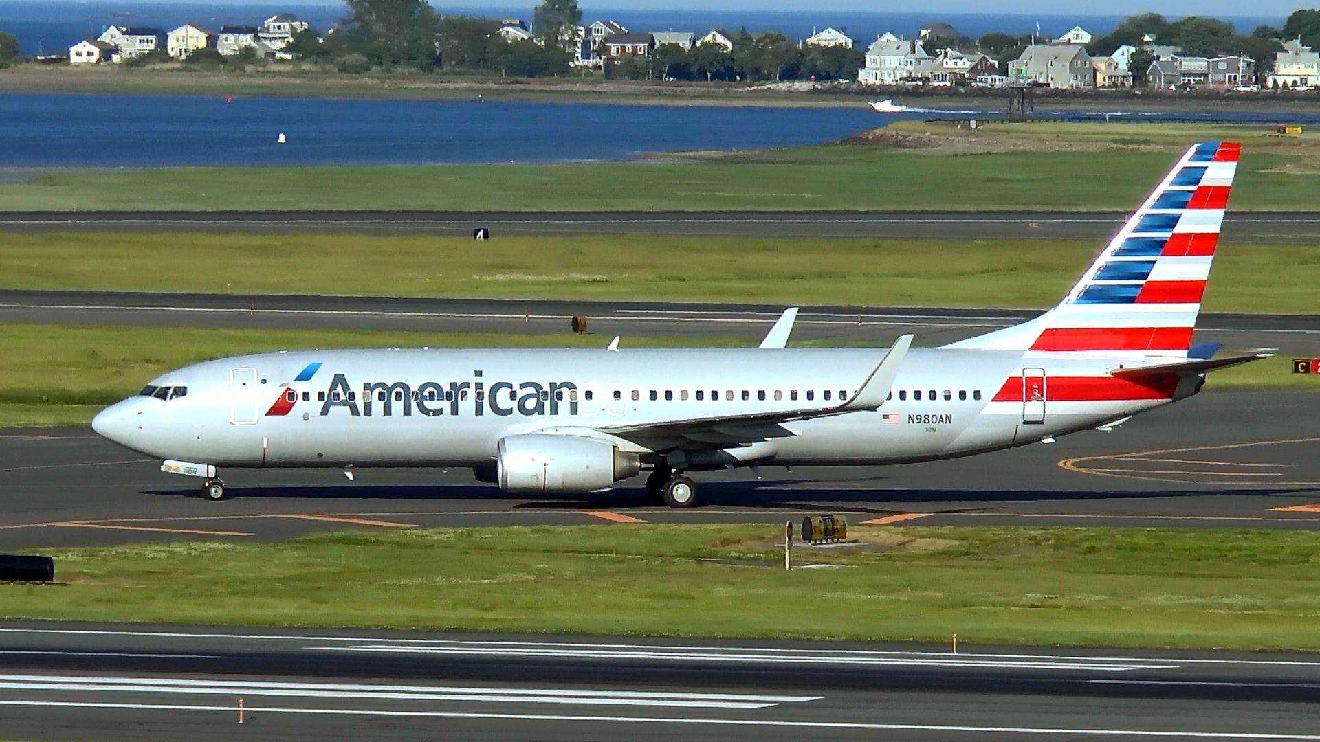 American Airlines new colors as it merges with US Airways. Seen here arriving at Logan Airport Boston, Massachusetts USA.