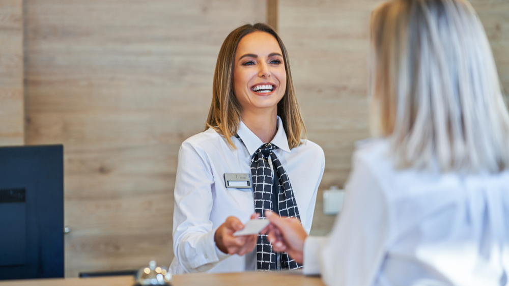 woman checking in a hotel