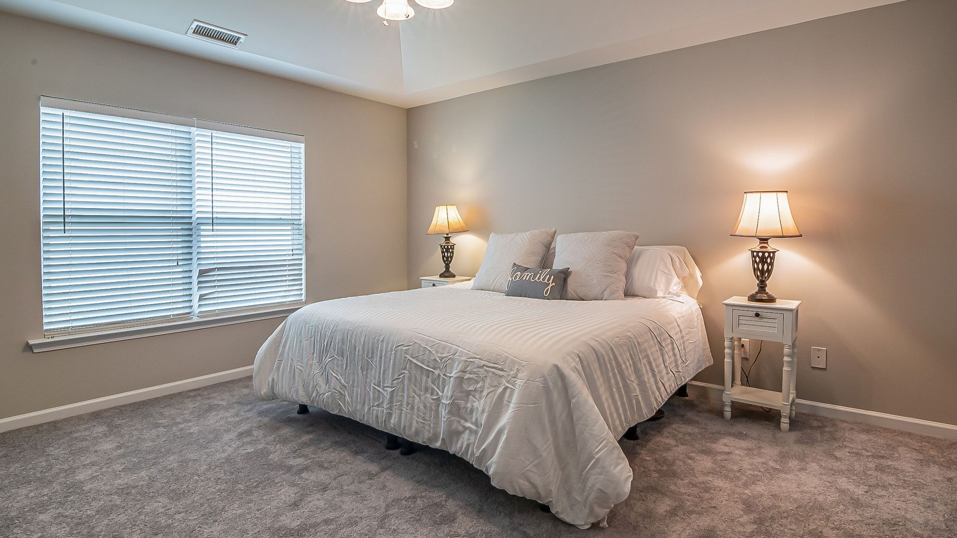 A modern and cozy bedroom with a king-size bed, soft lighting, and minimalist decor. Perfect for relaxation.
