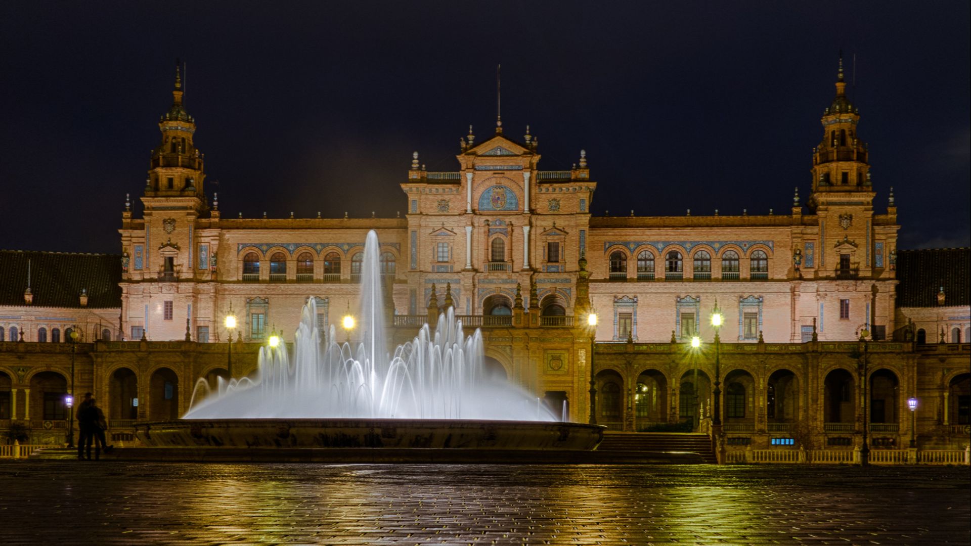 Fountain on Plaza de Espana at night / Seville, Spain