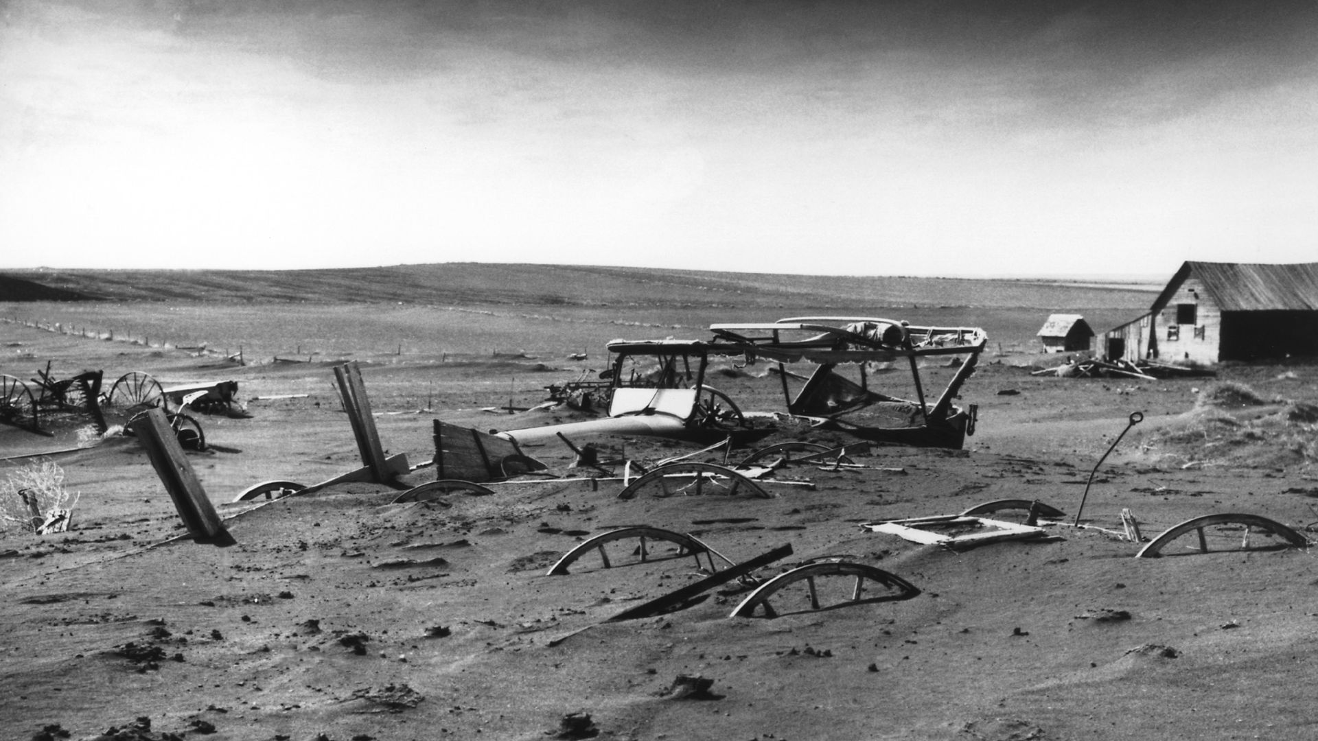 Buried machinery in barn lot in Dallas, South Dakota, United States during the Dust Bowl, an agricultural, ecological, and economic disaster in the Great Plains region of North America in 1936