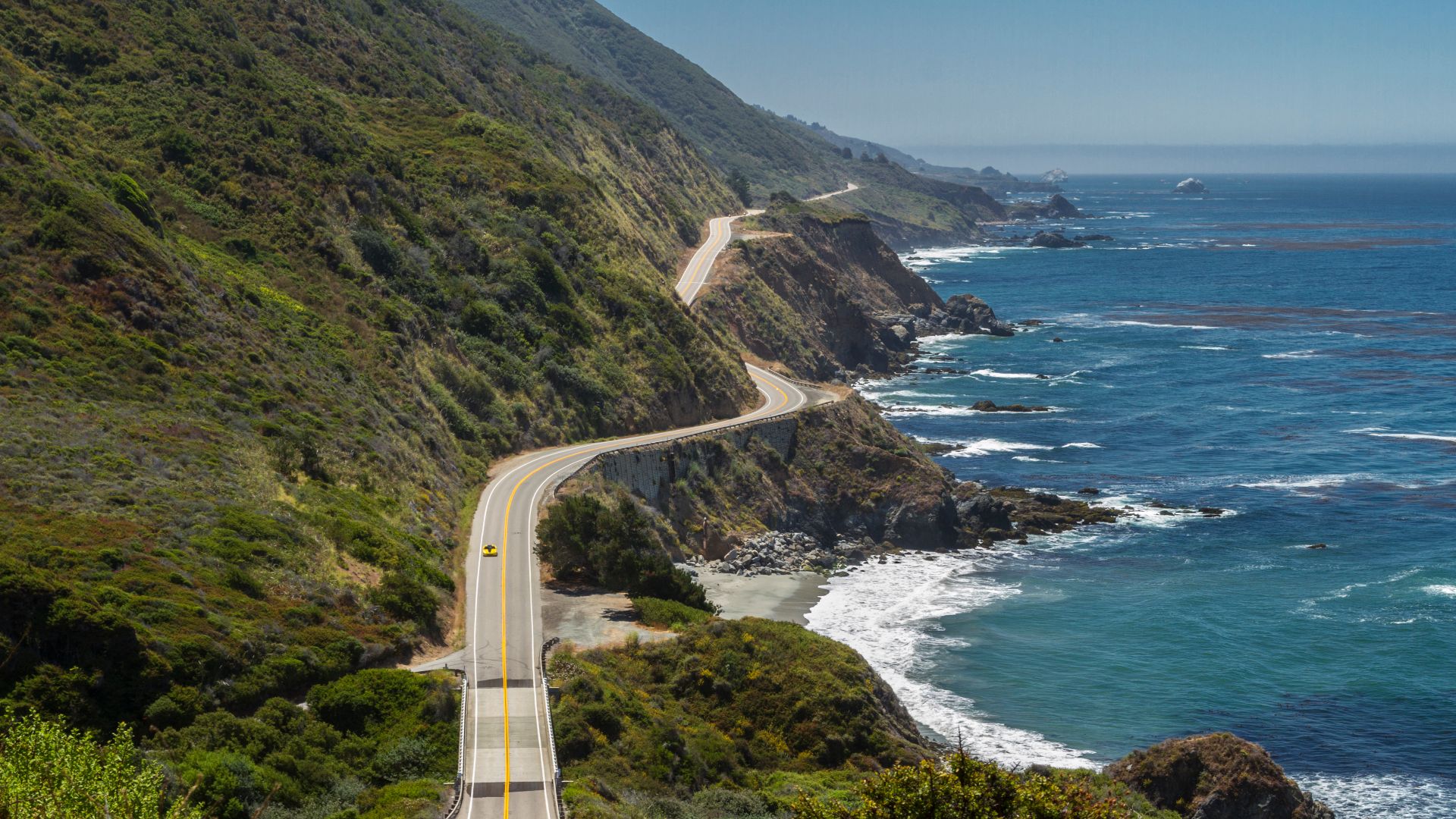 Highway 1 in Big Sur, California, clings to the coastal cliffs over much of its distance. This view looking south is about one mile north of Ragged Point, near the southern end of the Big Sur region.
