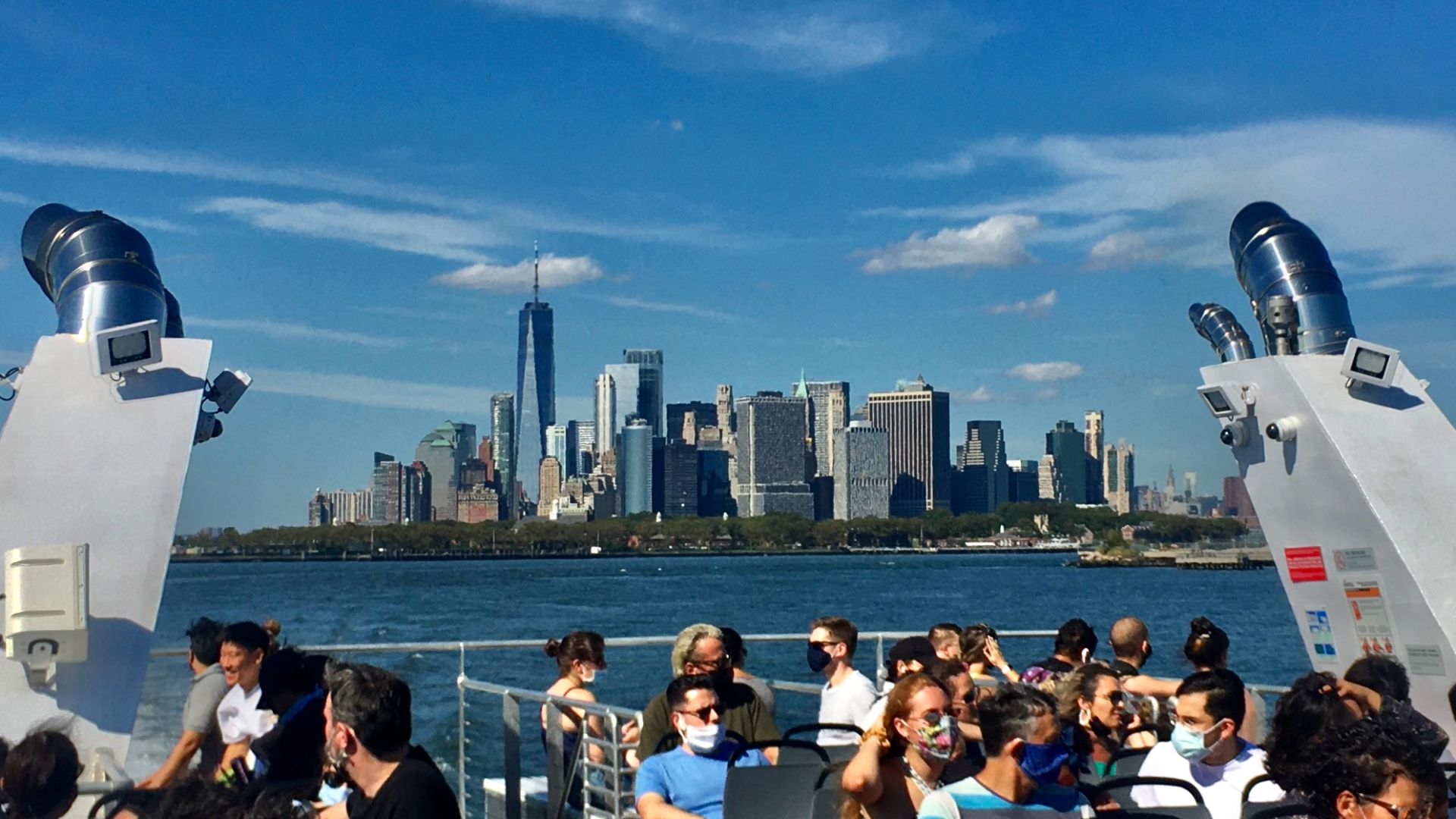 View from the front of the Rockaway Ferry boat off Red Hook, Brooklyn, looking backwards toward the Lower Manhattan skyline, September 2020.