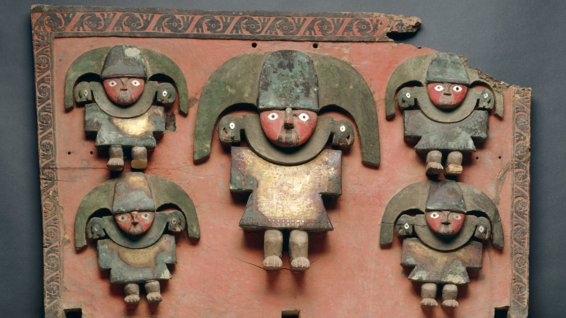 This rare, dramatic object served as the back support of a litter carried by human porters, a mode of transport reserved for honored members of many societies without draft animals or wheeled vehicles. The simple, bold figures-perhaps a Chimú lord and fou