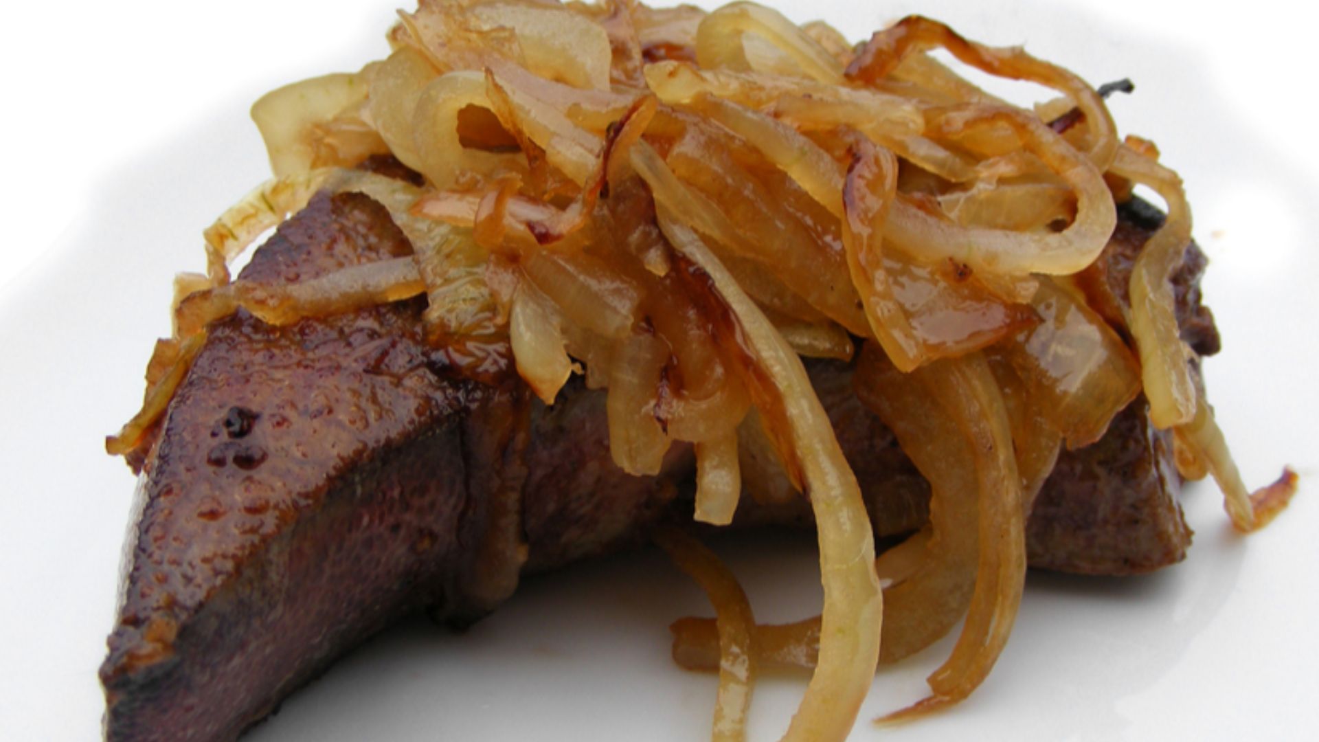 Gently panfried slice of Berkshire pig's liver with sauteed onion.