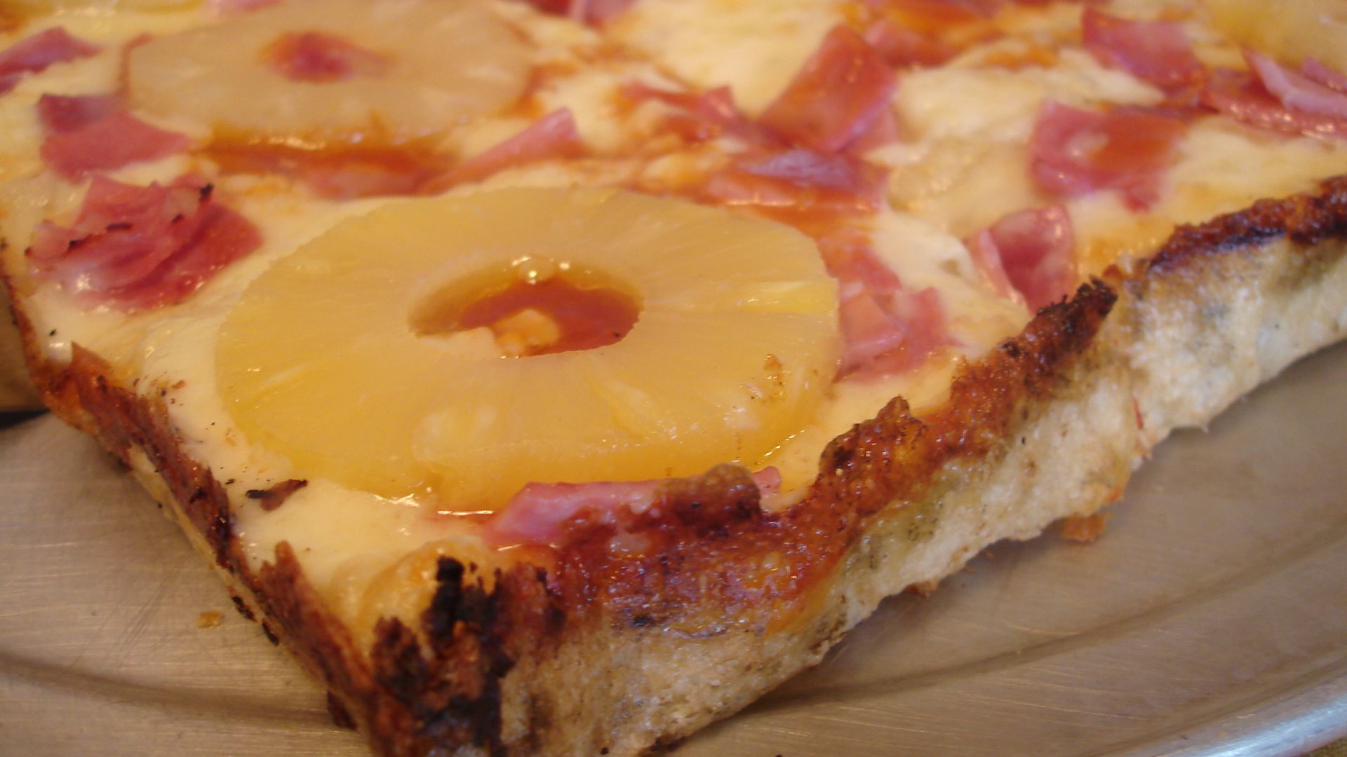 Close-up view of a Hawaiian pan pizza