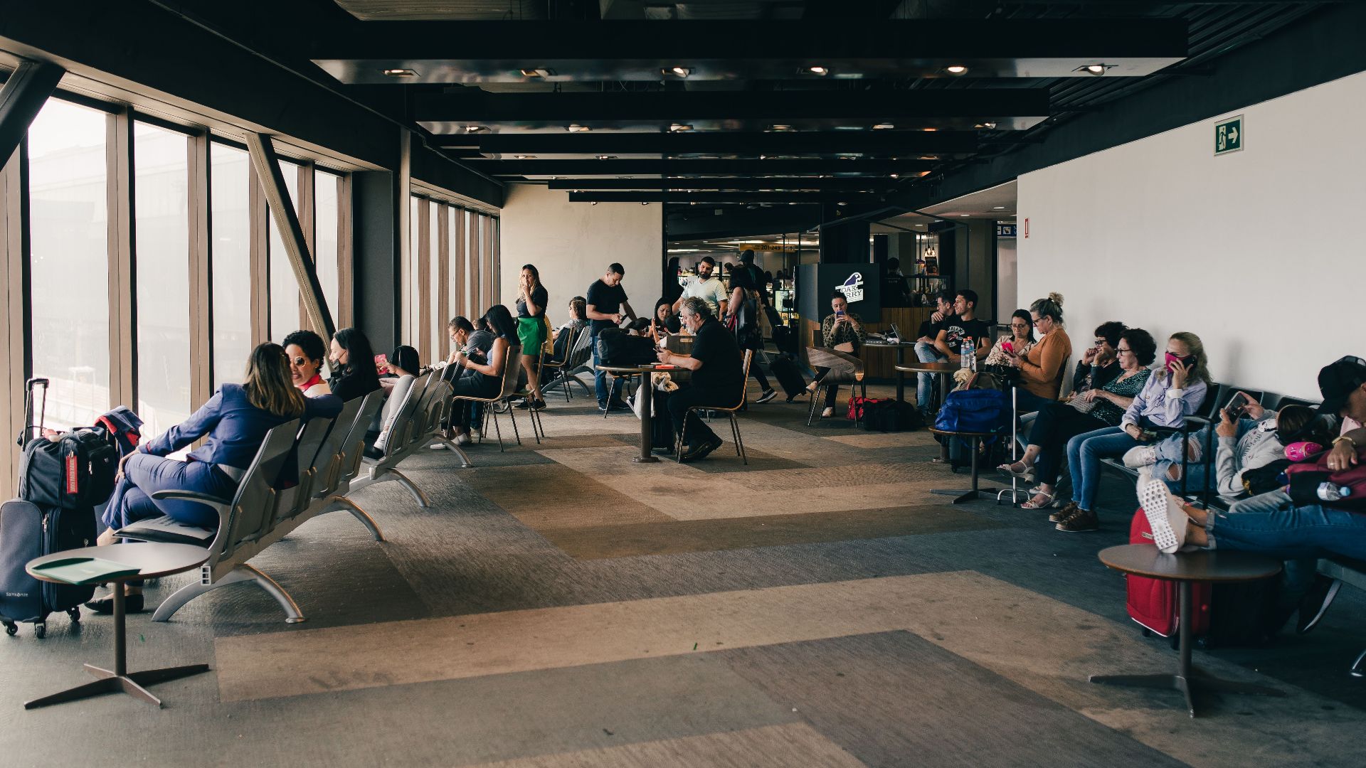 Passengers relaxing in a São Paulo airport waiting area, capturing a travel moment.